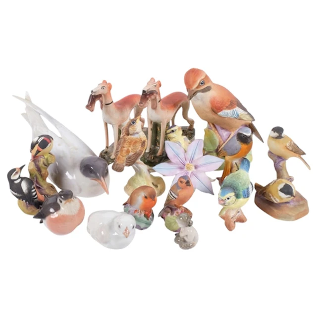 A collection of various ceramic animal figures, including a ...