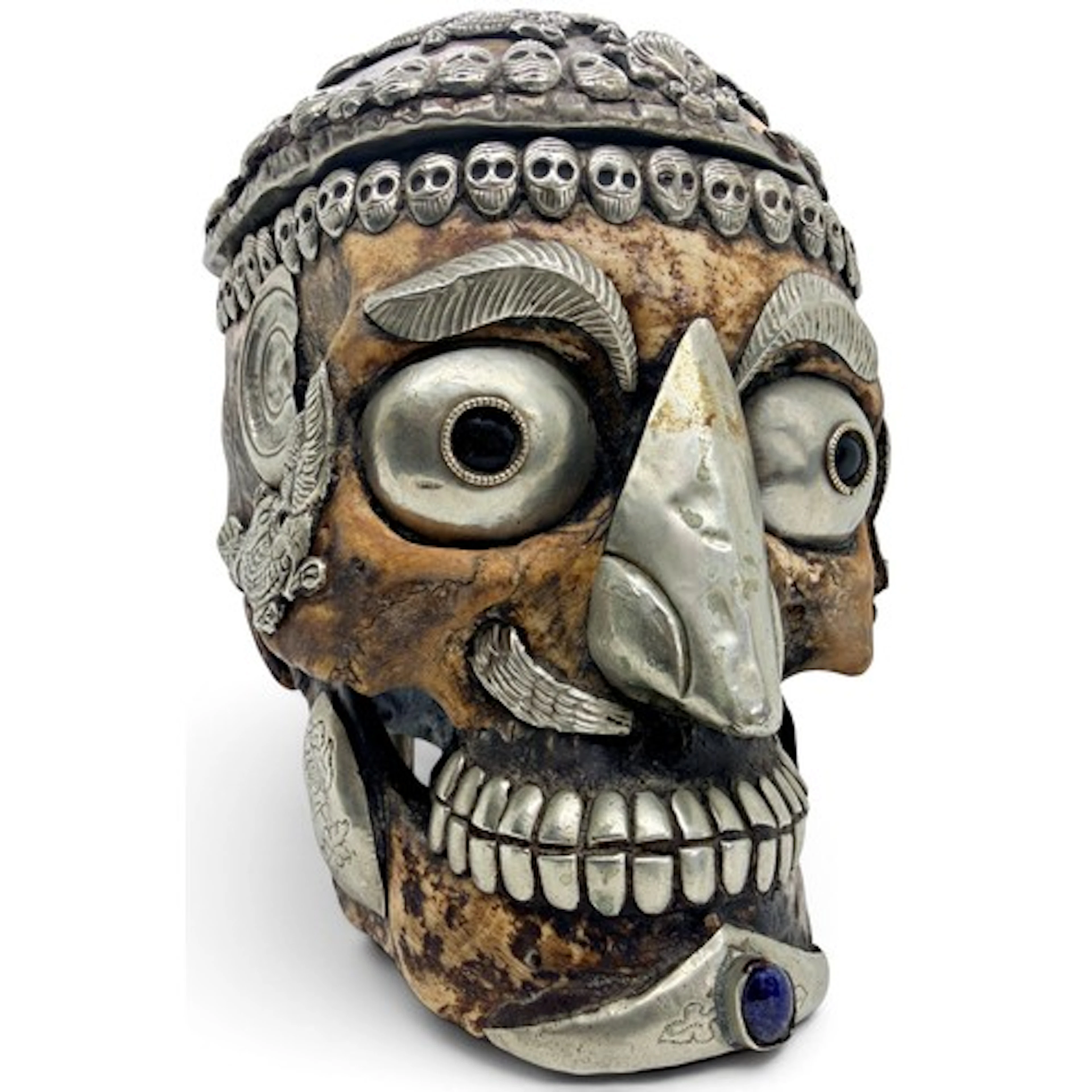 A Tibetan Kapala human skull with white metal and cabochon g...