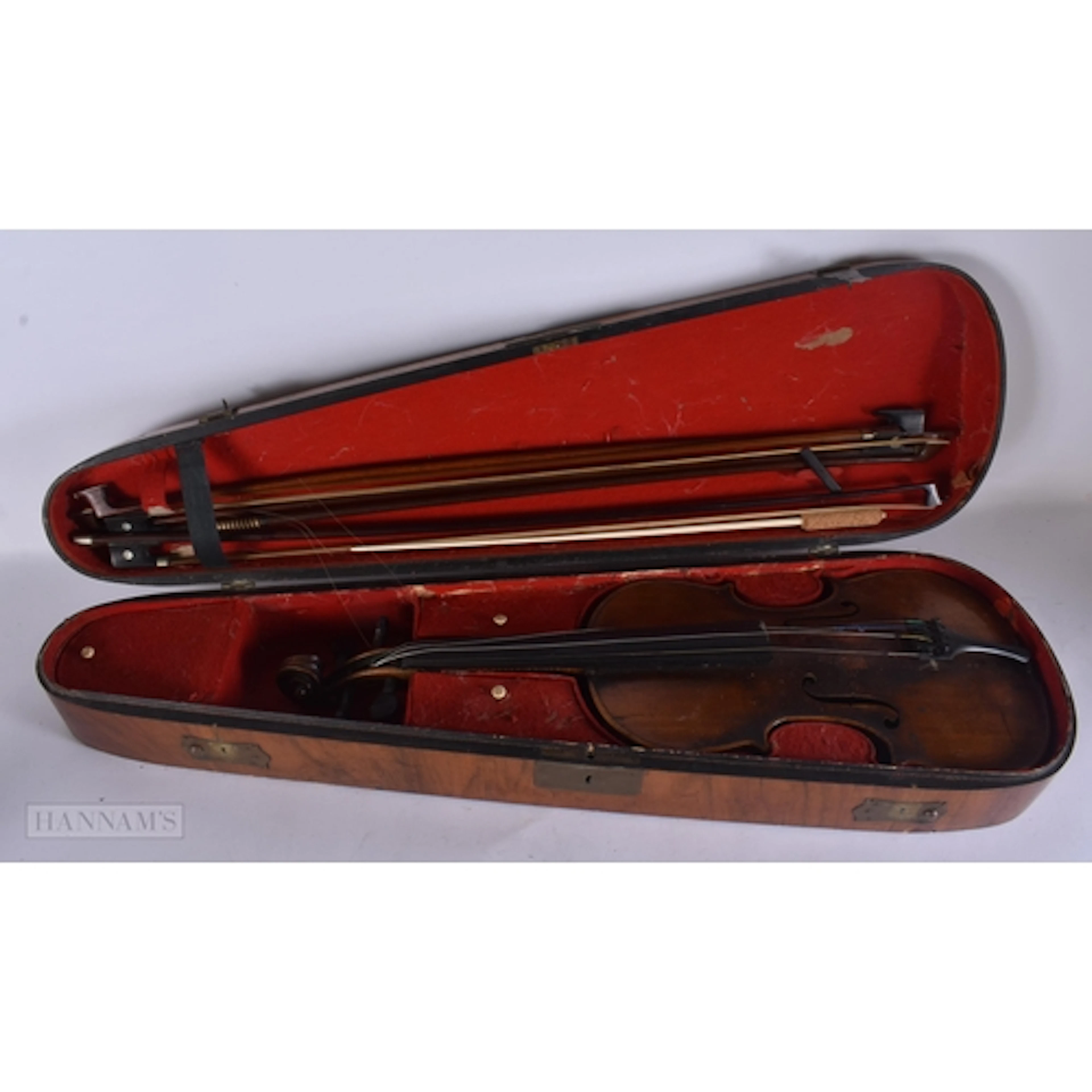 A CASED VIOLIN and bows. 58.5 cm long, length of back exclud...