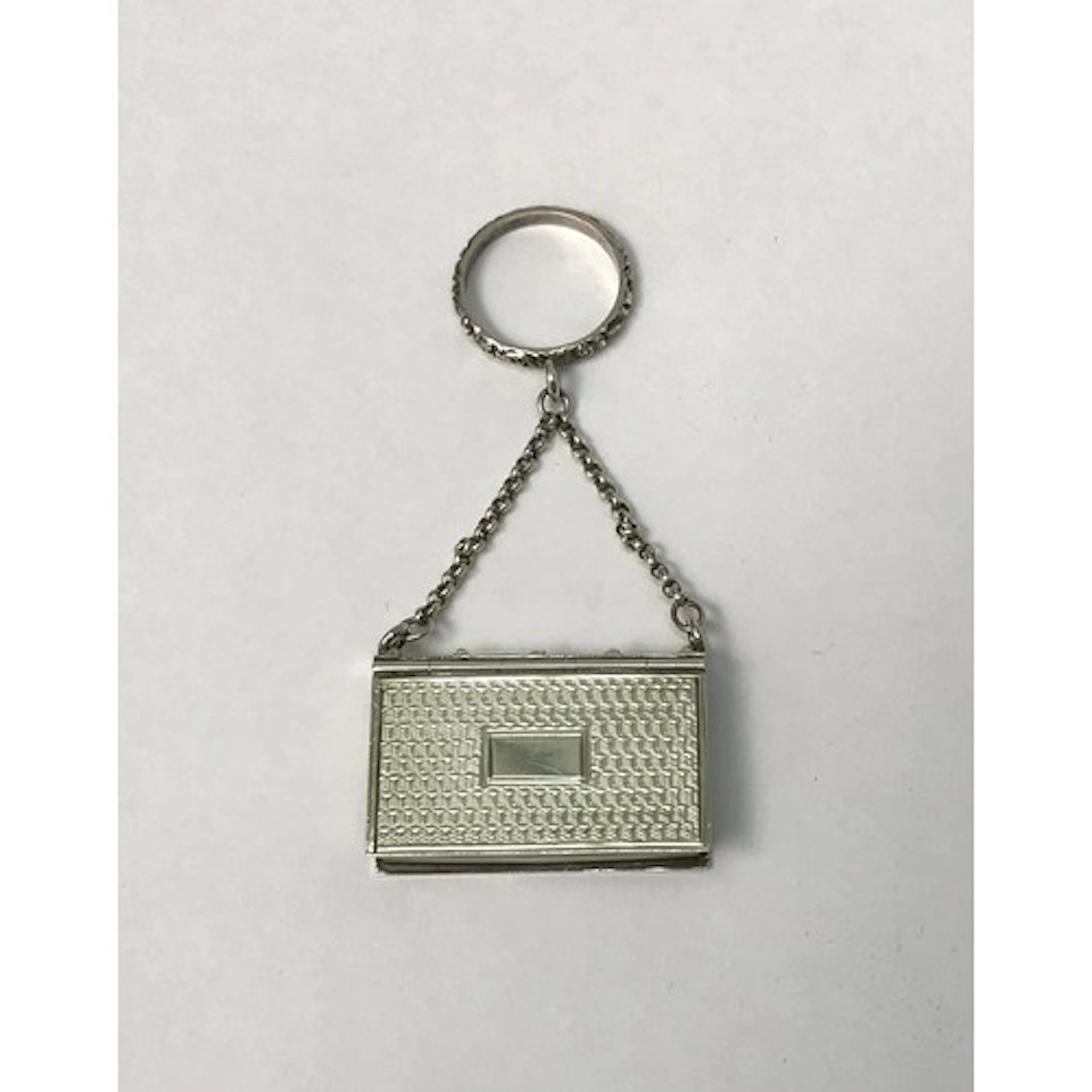 A William IV silver vinaigrette case modelled as a leather b...