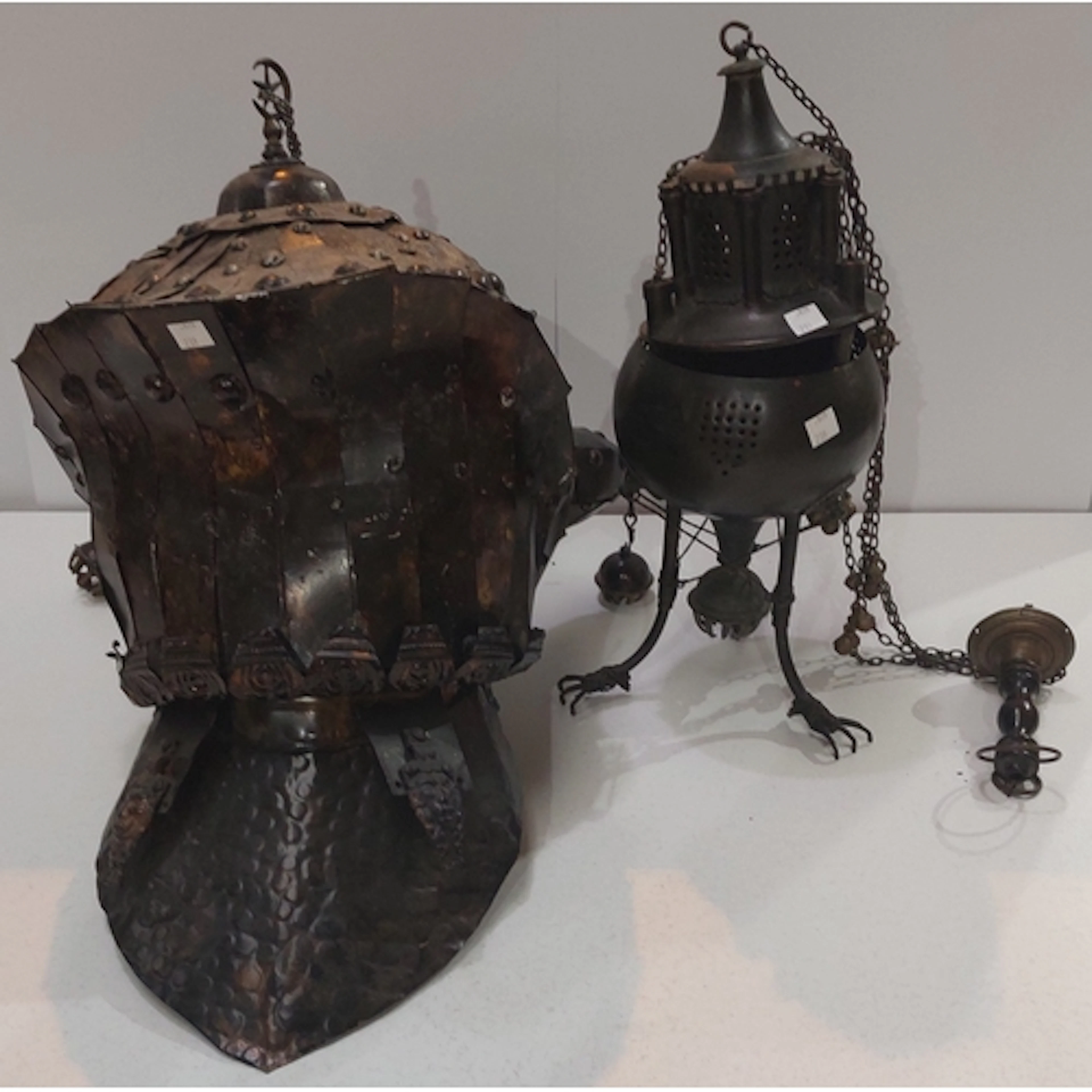 A period style metal knight's helmet with bells & a simi...