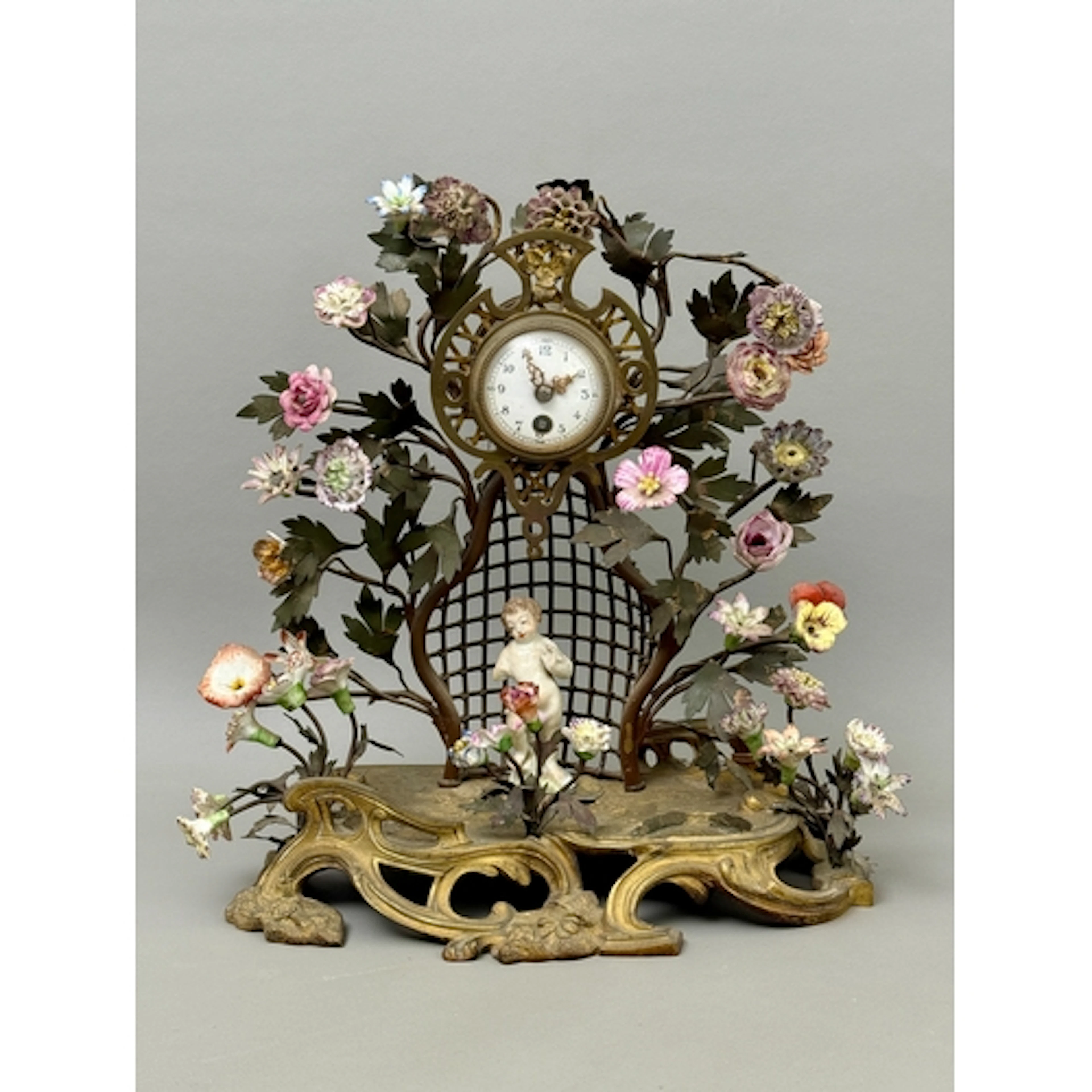 A gilt bronze, tole peinte and porcelain mantel clock, Frenc...