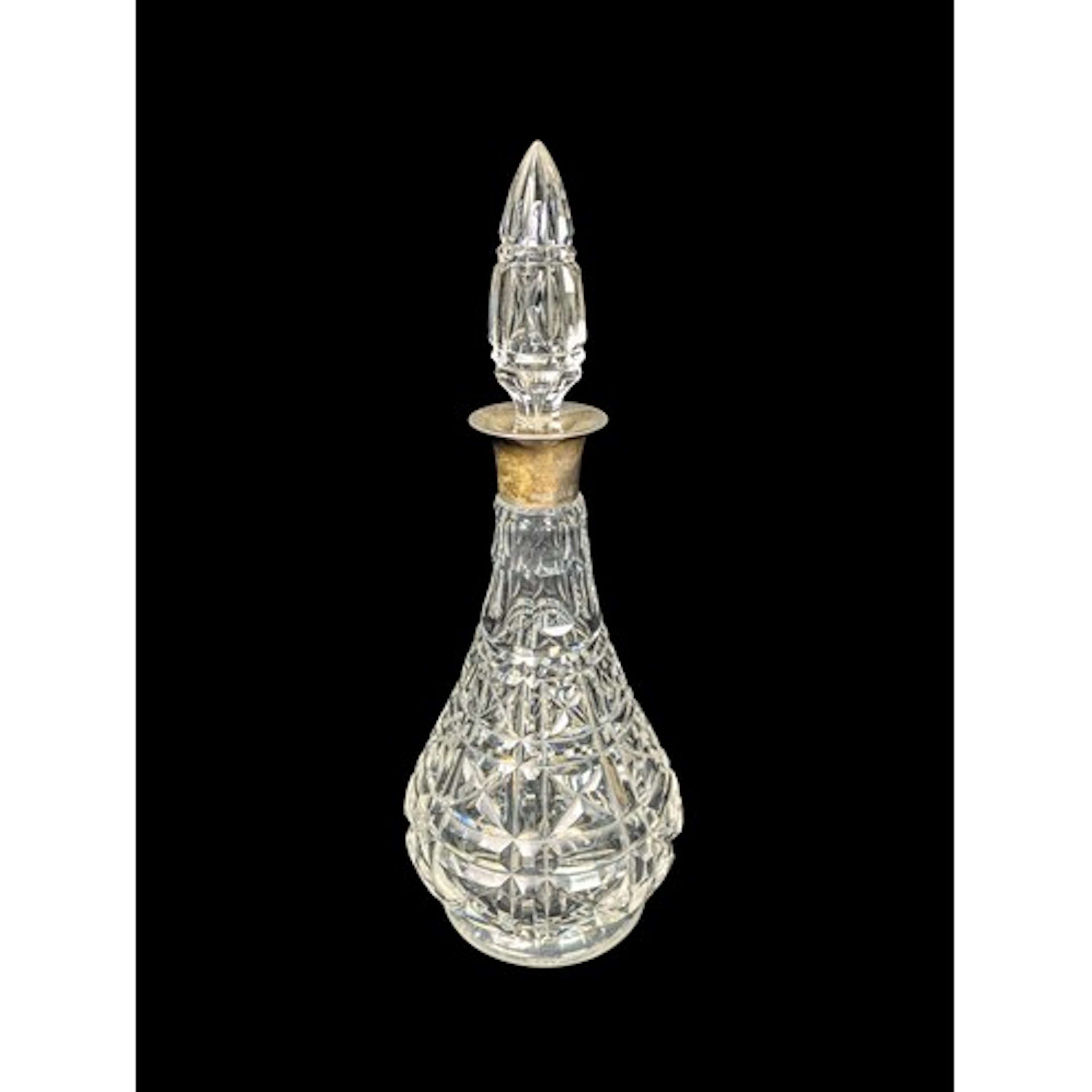 Cut-glass decanter of pear form, with geometric cutting, a f...