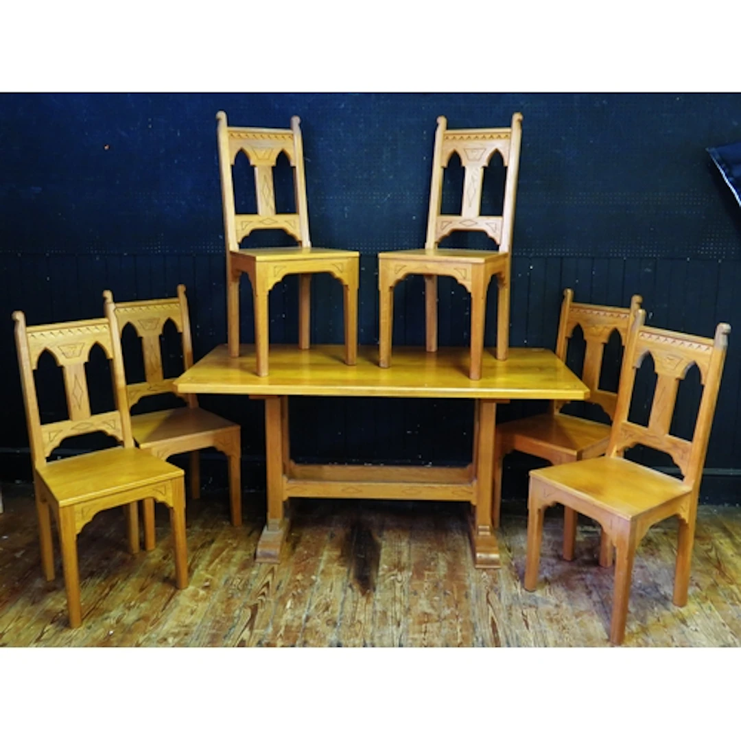 A Peter Doxsey oak dining table in the Gothic taste, the rec...