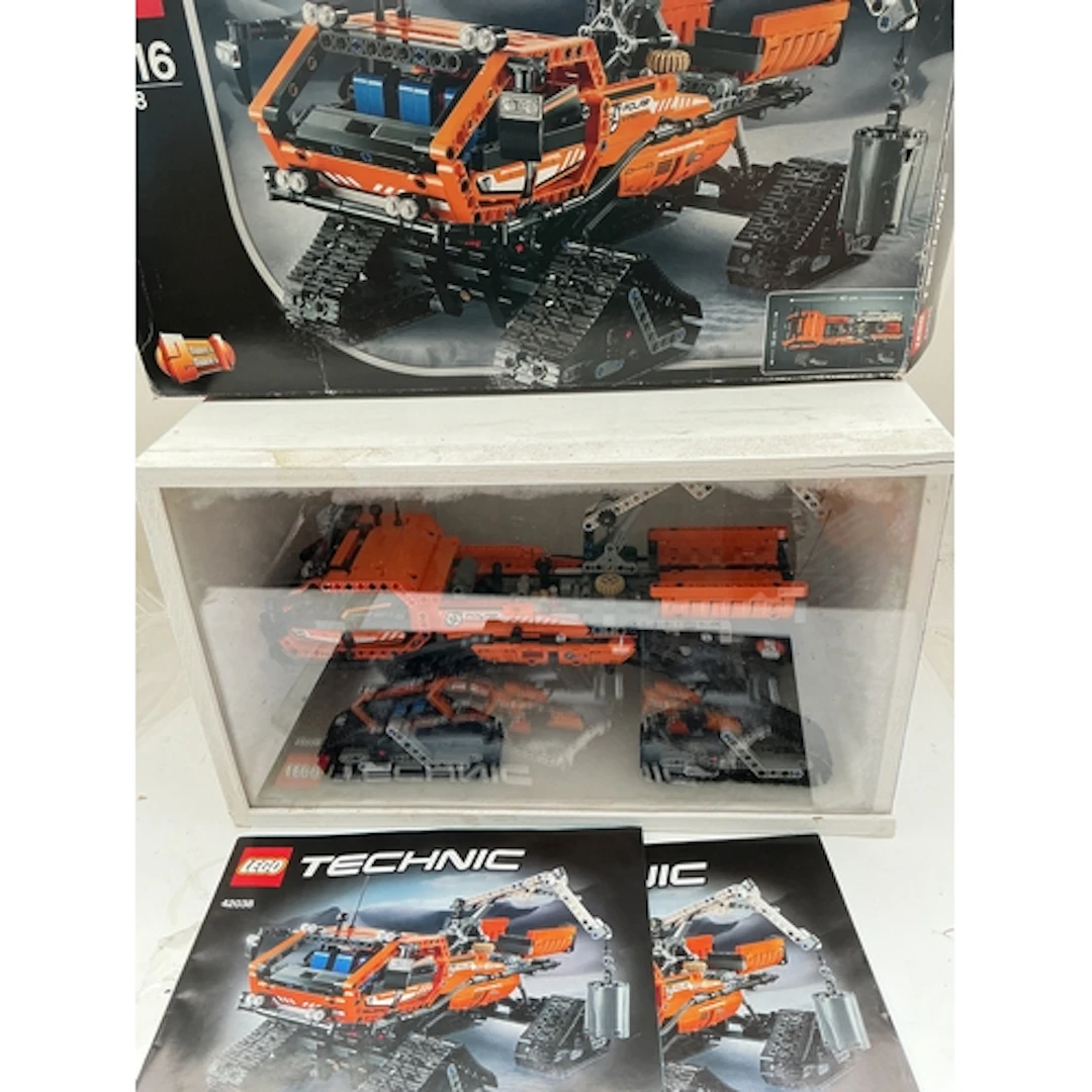 A Lego Technic Artic Truck, In Display Case With Manuals and...