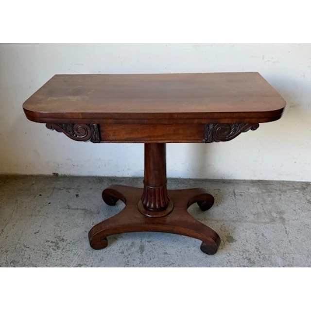 A Regency style Mahogany fold over pedestal card table...