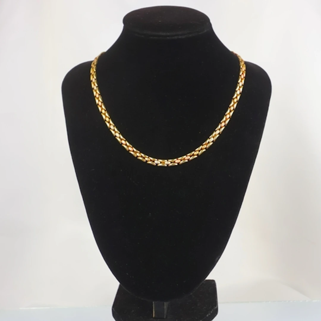 A contemporary 9ct three tone necklace, the gate link style ...