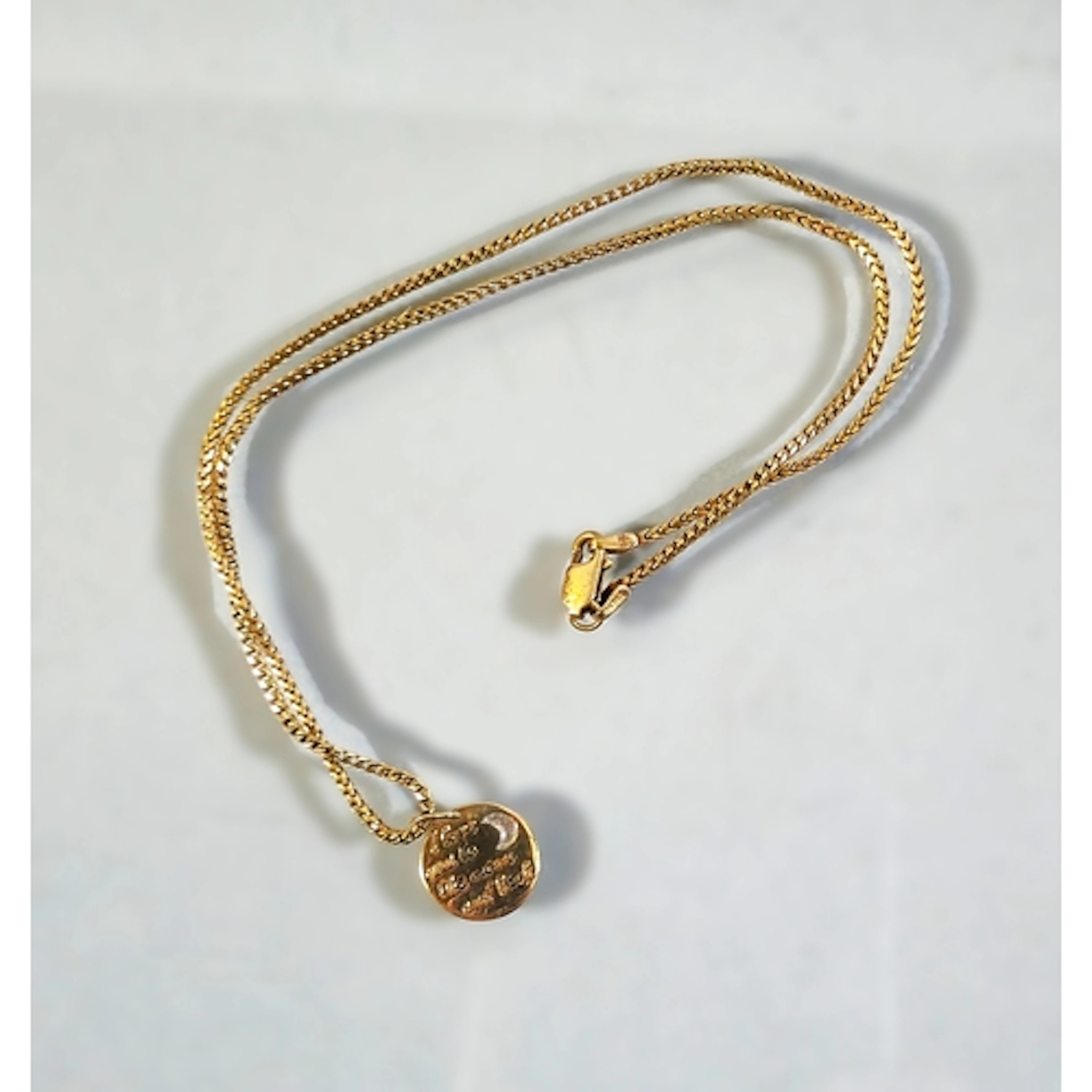 9ct gold chain with attached unmarked yellow metal engraved ...