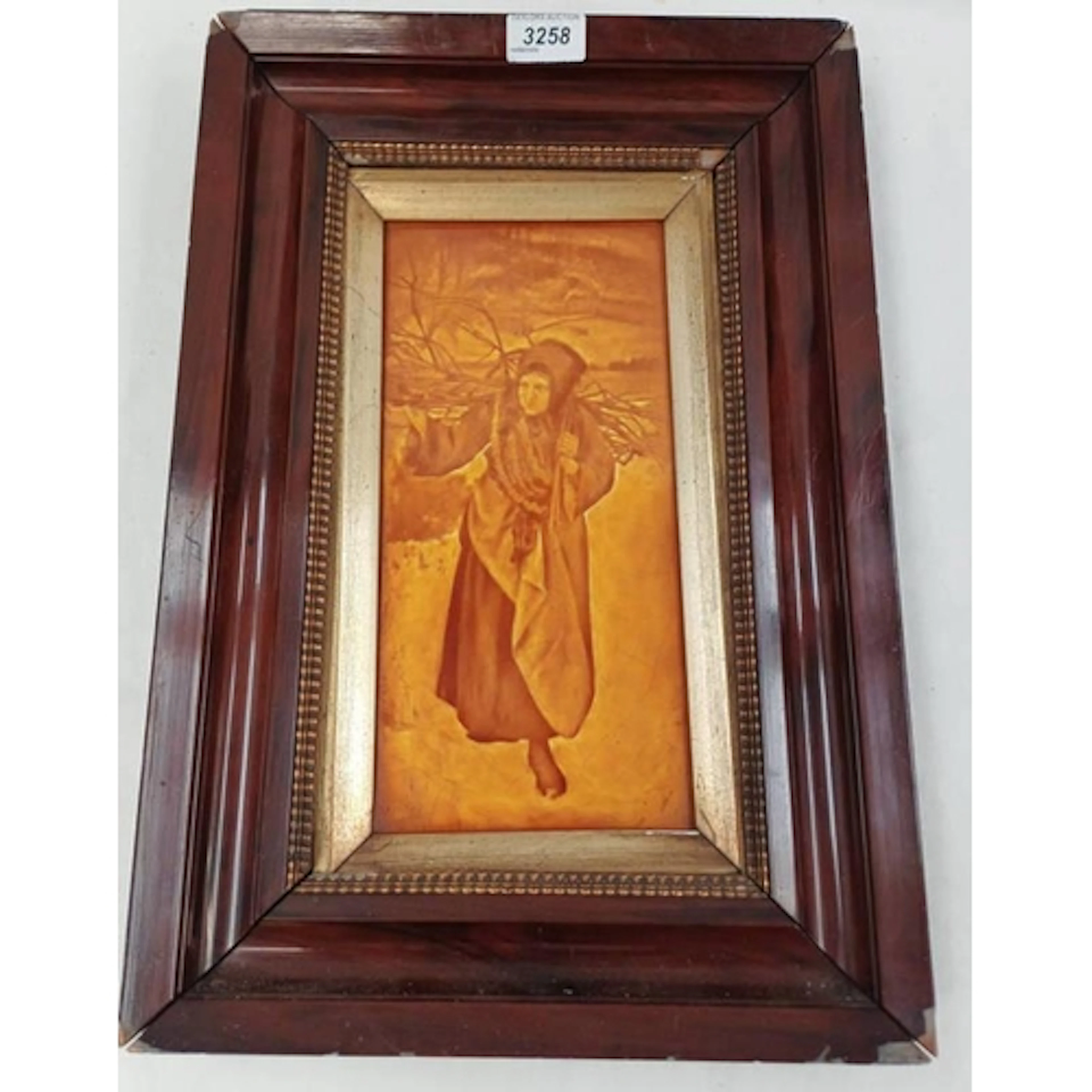 MAHOGANY FRAMED PORCELAIN TILE / PLAQUE OF A RURAL WOMAN CAR...