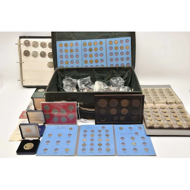 An old suitcase containing a coin album with 4 pages contain...