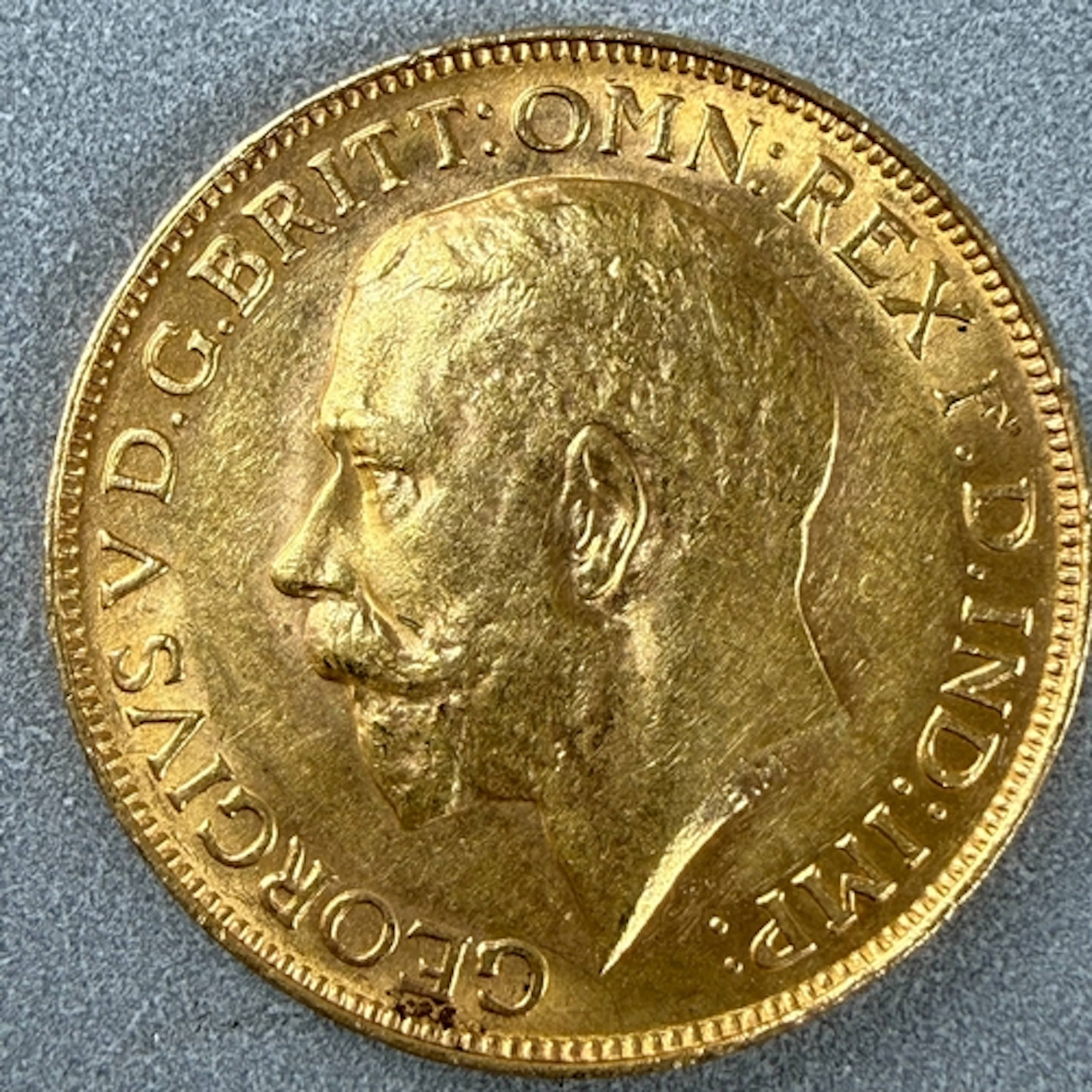 Coins: a 1913 George V full gold sovereign, circulated....