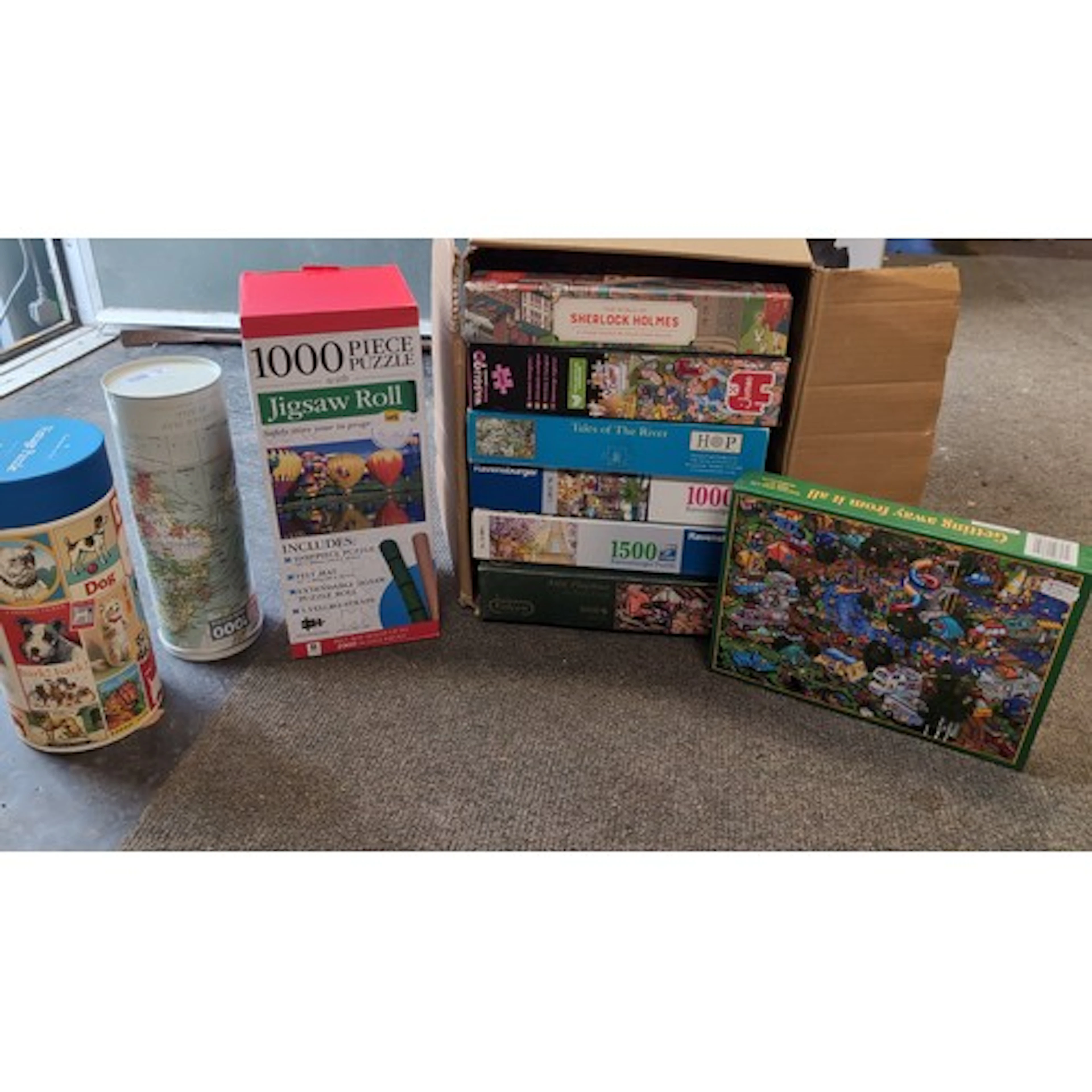 A group of jigsaw puzzles and accessories, including Ravensb...