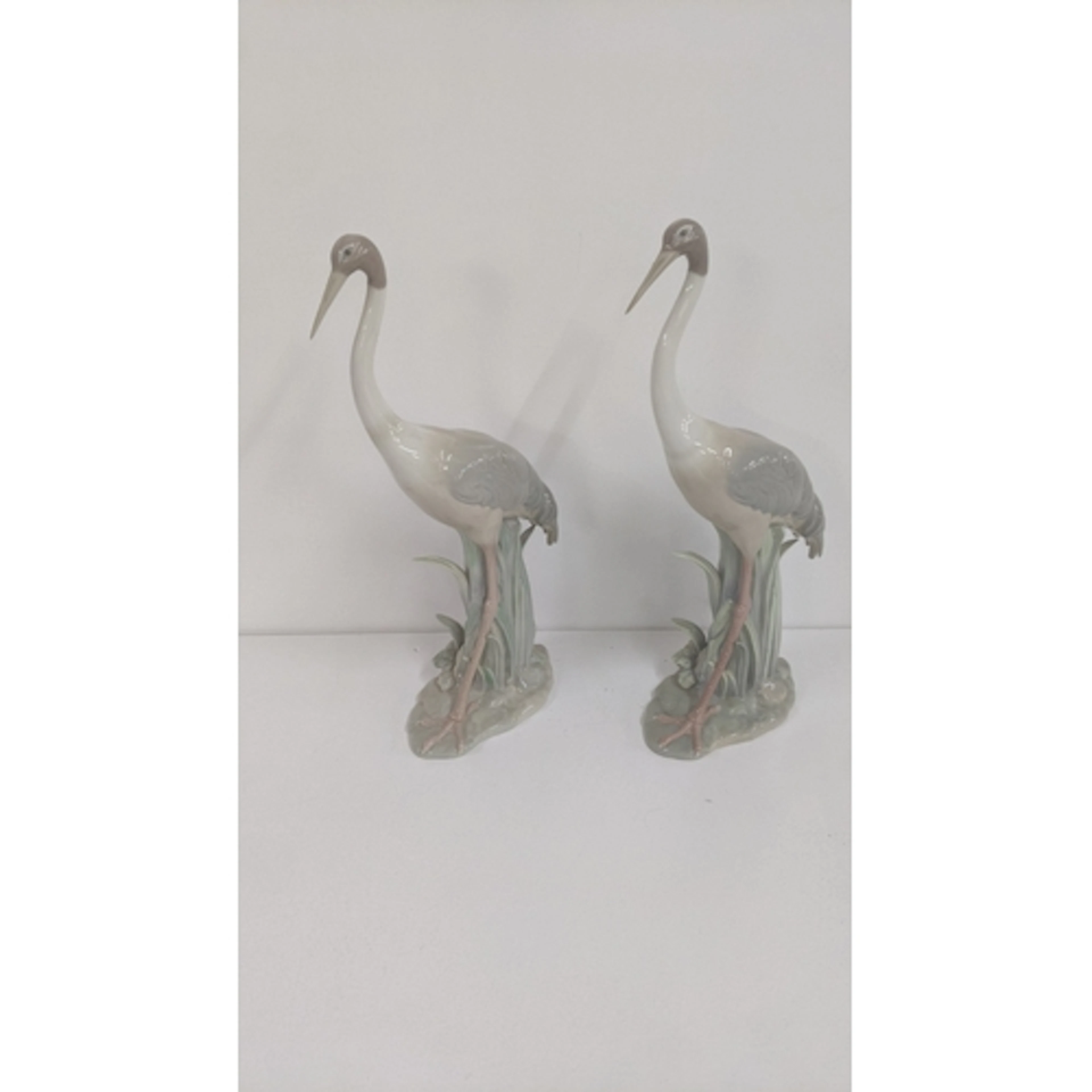 A pair of Lladro porcelain crane figurines no 1032, without ...