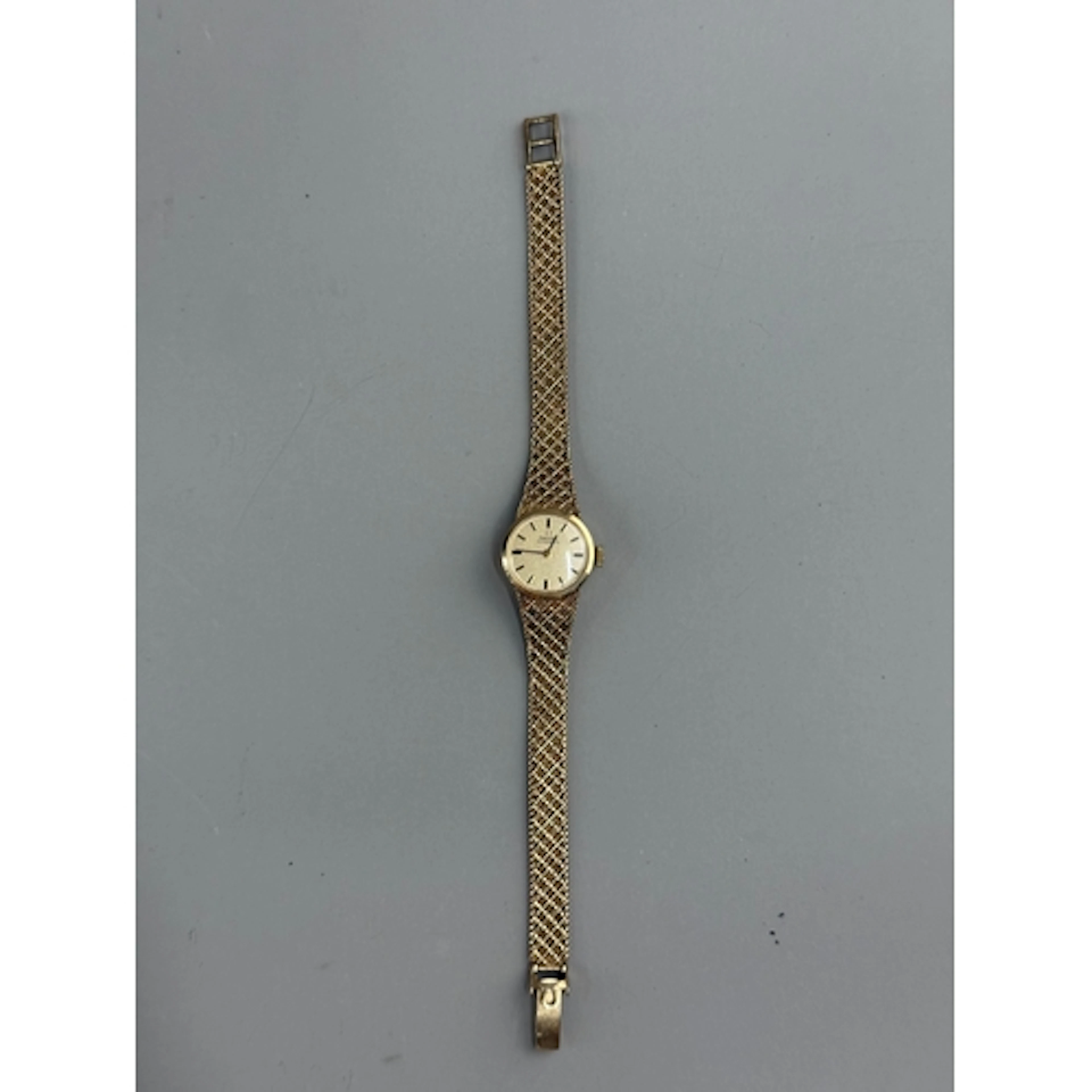 Watches: a ladies 9ct gold Omega automatic wristwatch on int...