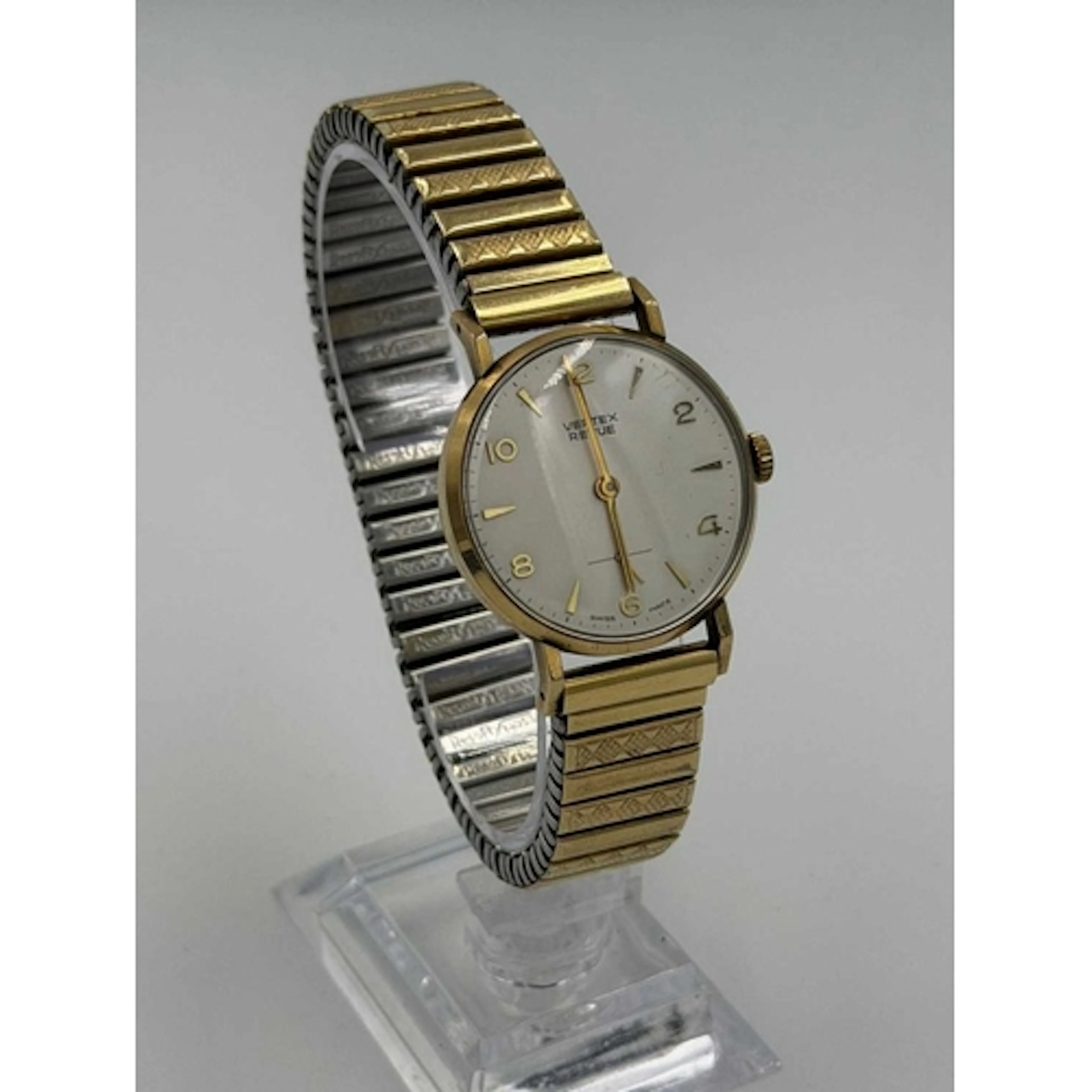 A 9ct gold, engraved, Vertex Revue gold watch, on replacemen...