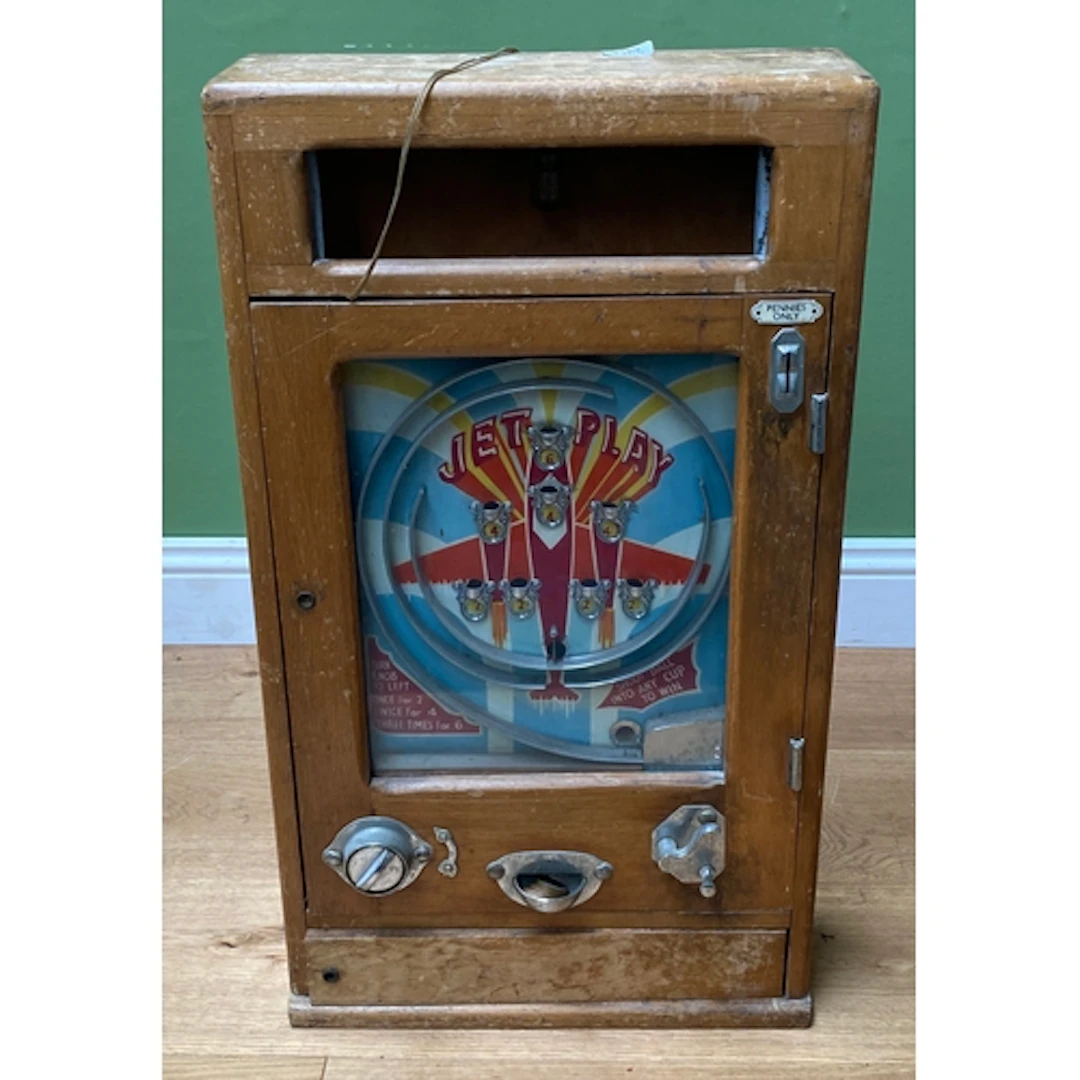 A 'Jet Play' antique arcade coin operated penny slot machine...