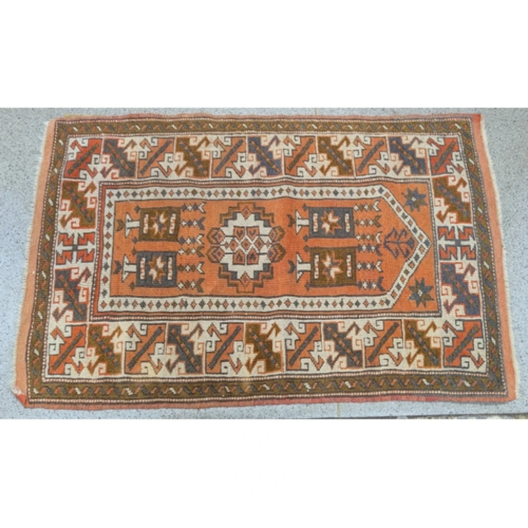 An Afghan prayer rug, on orange ground, multiguard border, c...