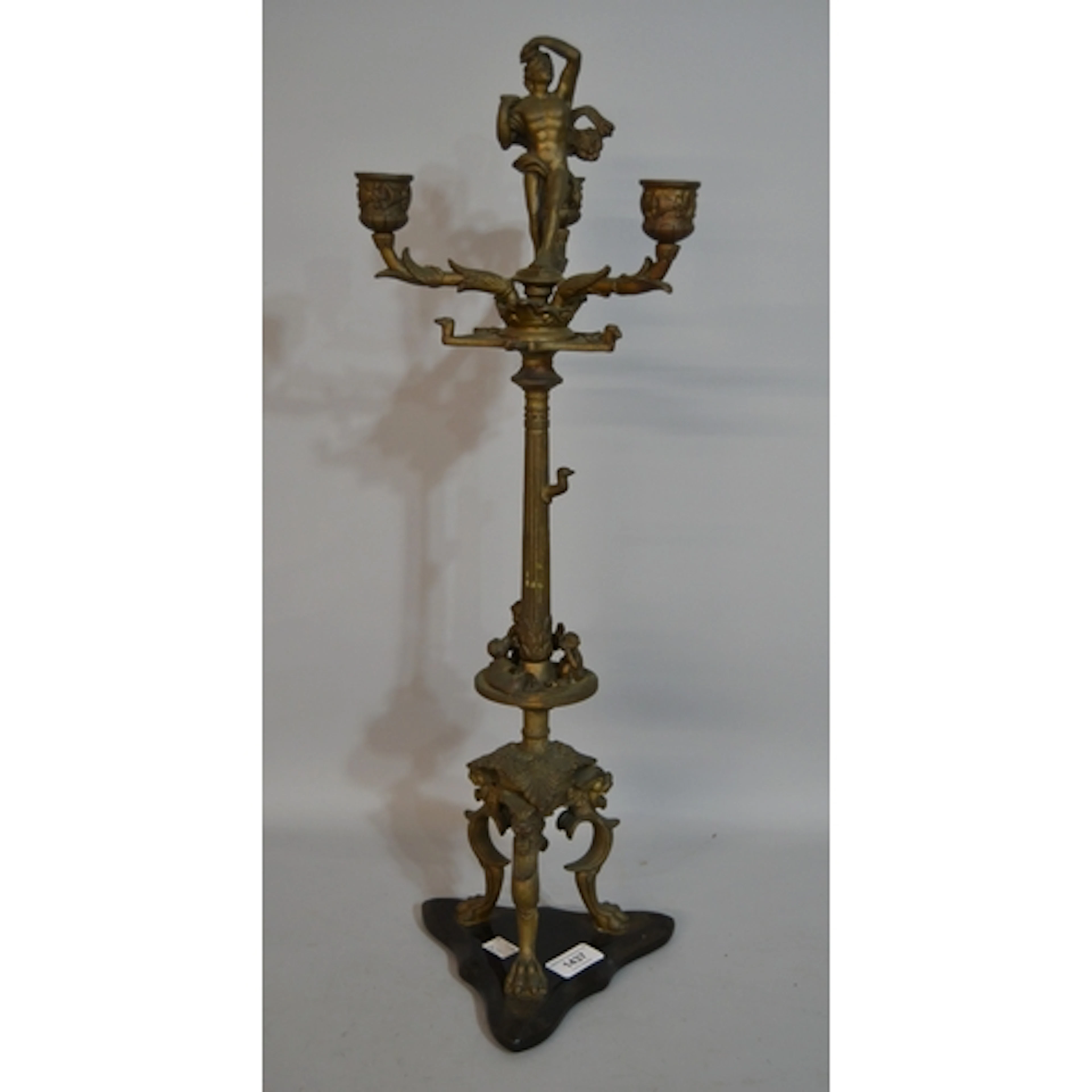 Antique style brass, three branch figural mounted candelabra...