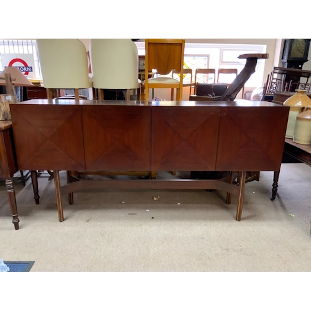 A mid-century dining suite, the sideboard, often called a "P...