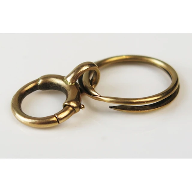 An antique high carat precious yellow metal bolt ring, c. 12...