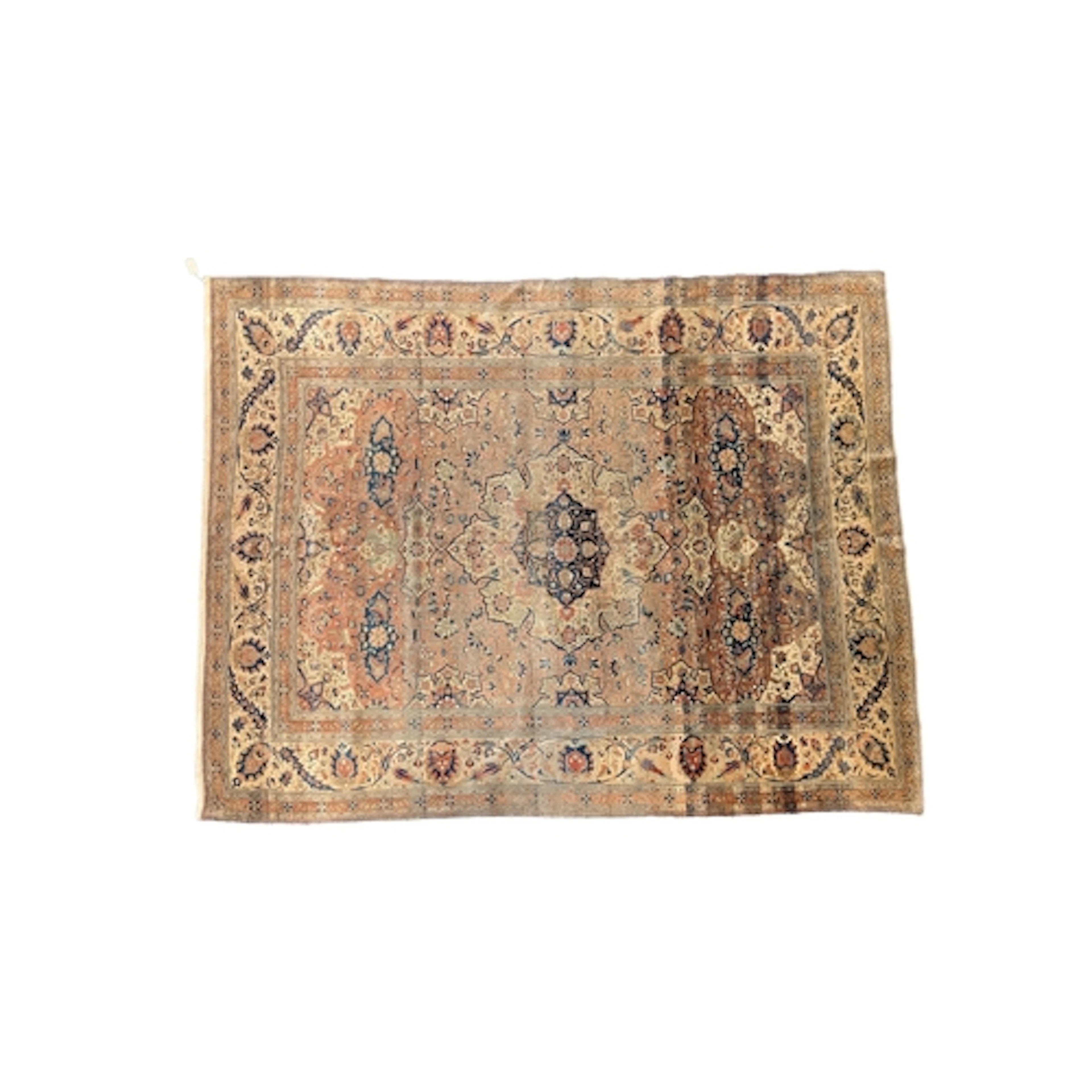 An antique Mohtasham Kashan faded red ground carpet, with ce...