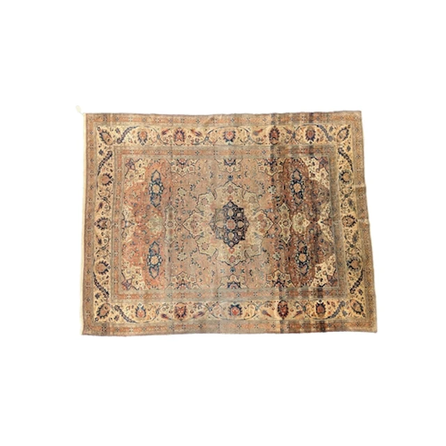 An antique Mohtasham Kashan faded red ground carpet, with ce...