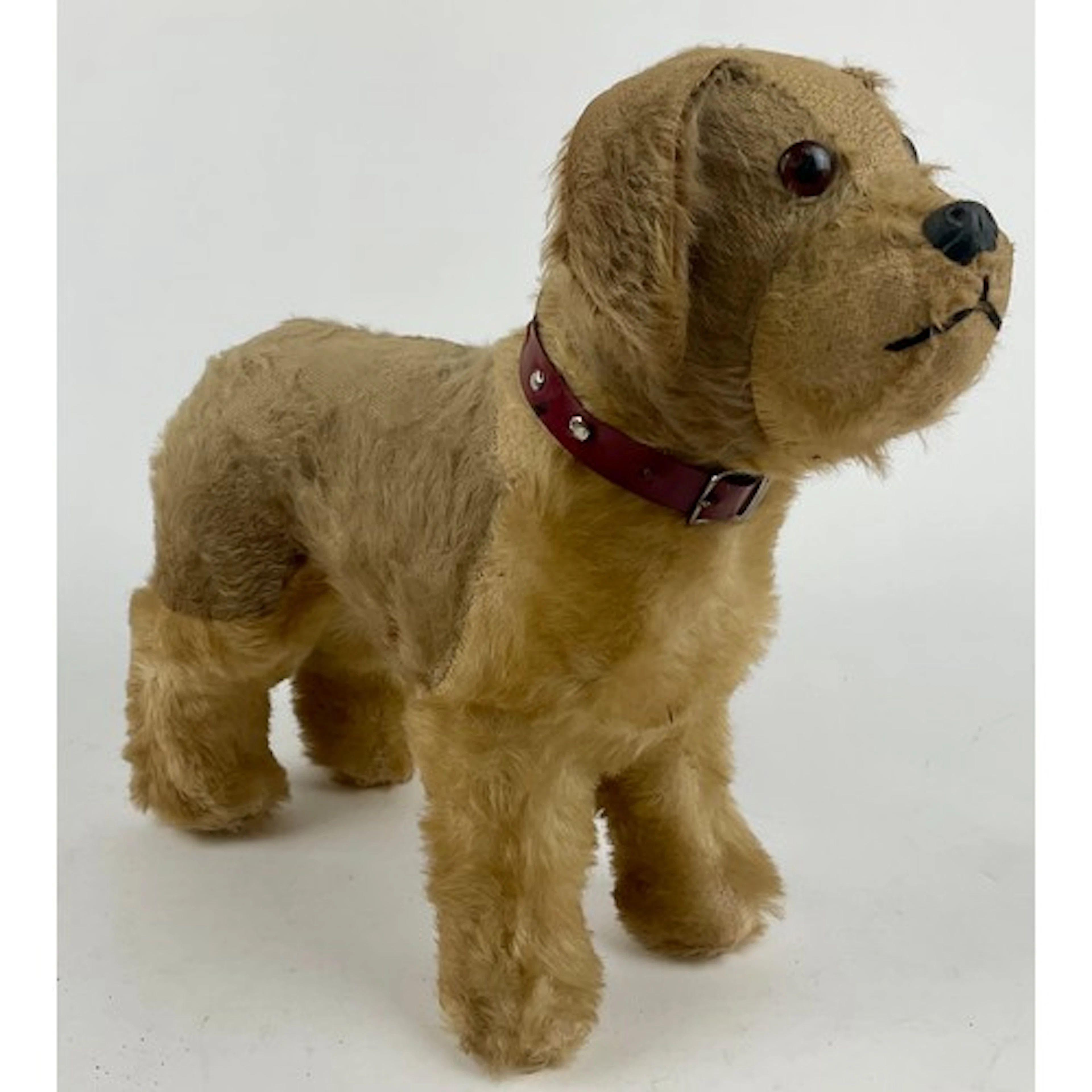 A large 1950’s freestanding mohair Terrier, dark amber eyes,...
