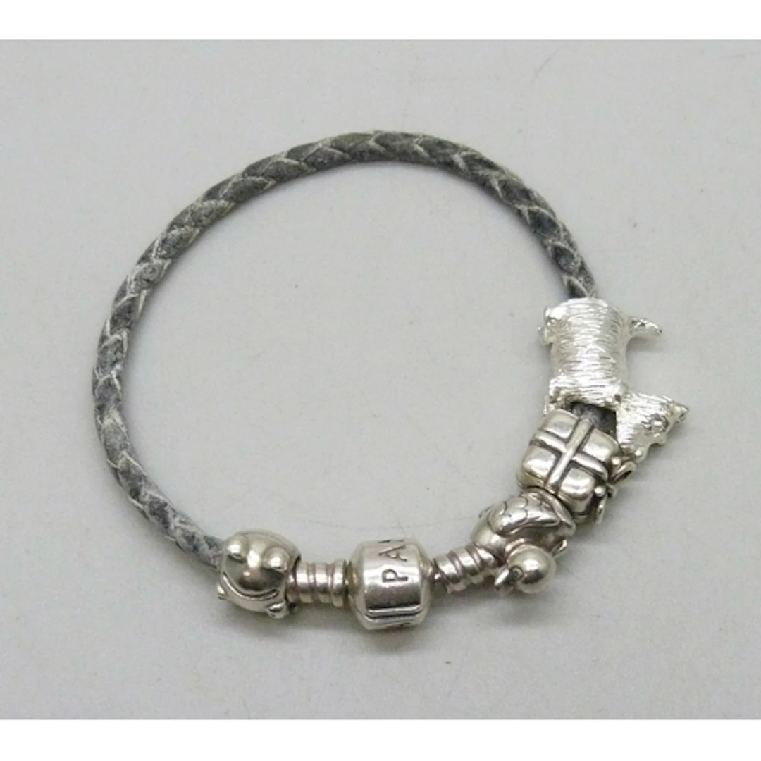 A Pandora silver mounted bracelet with three silver Pandora ...