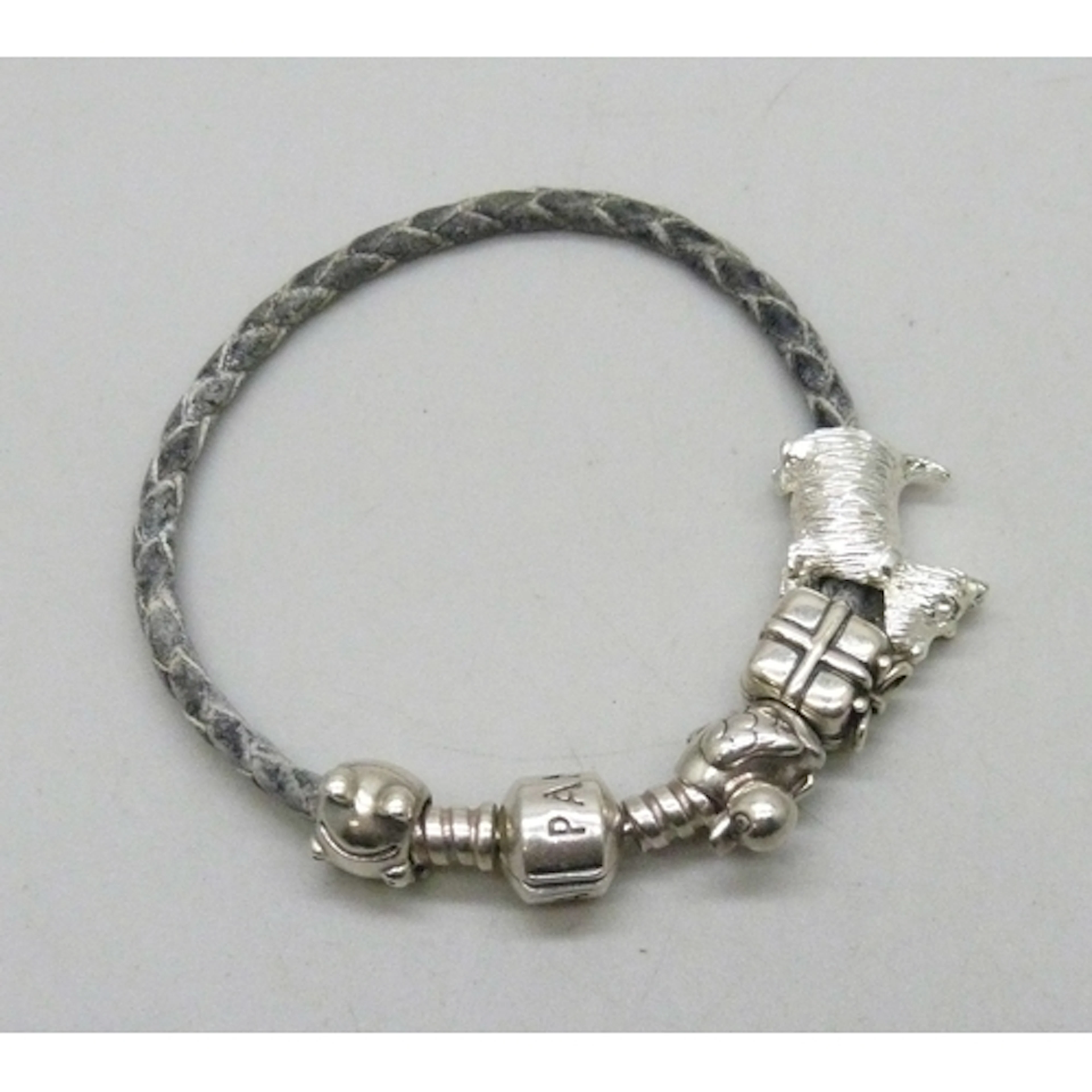 A Pandora silver mounted bracelet with three silver Pandora ...