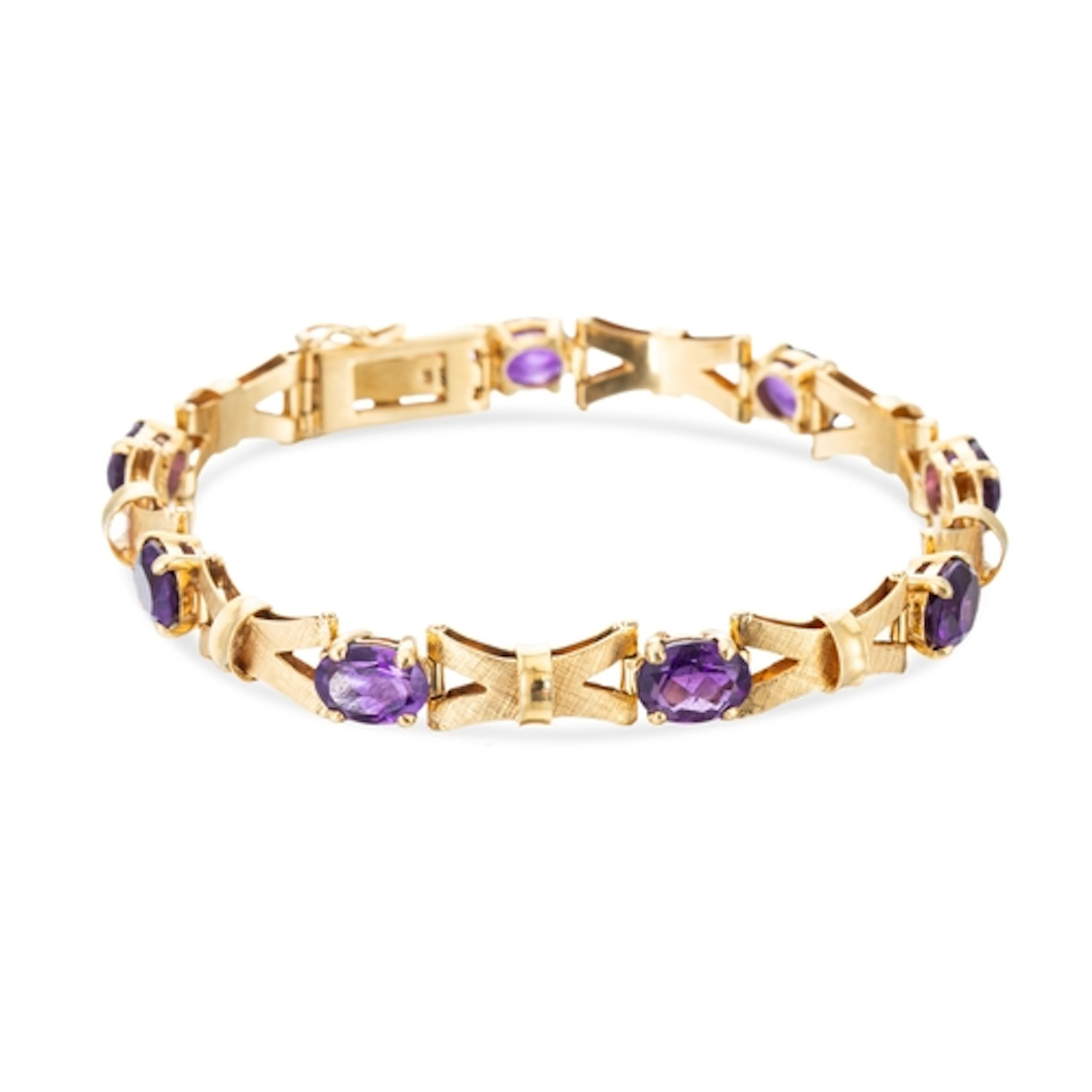 A VINTAGE 18CT YELLOW GOLD AMETHYST SET BRACELET, textured s...