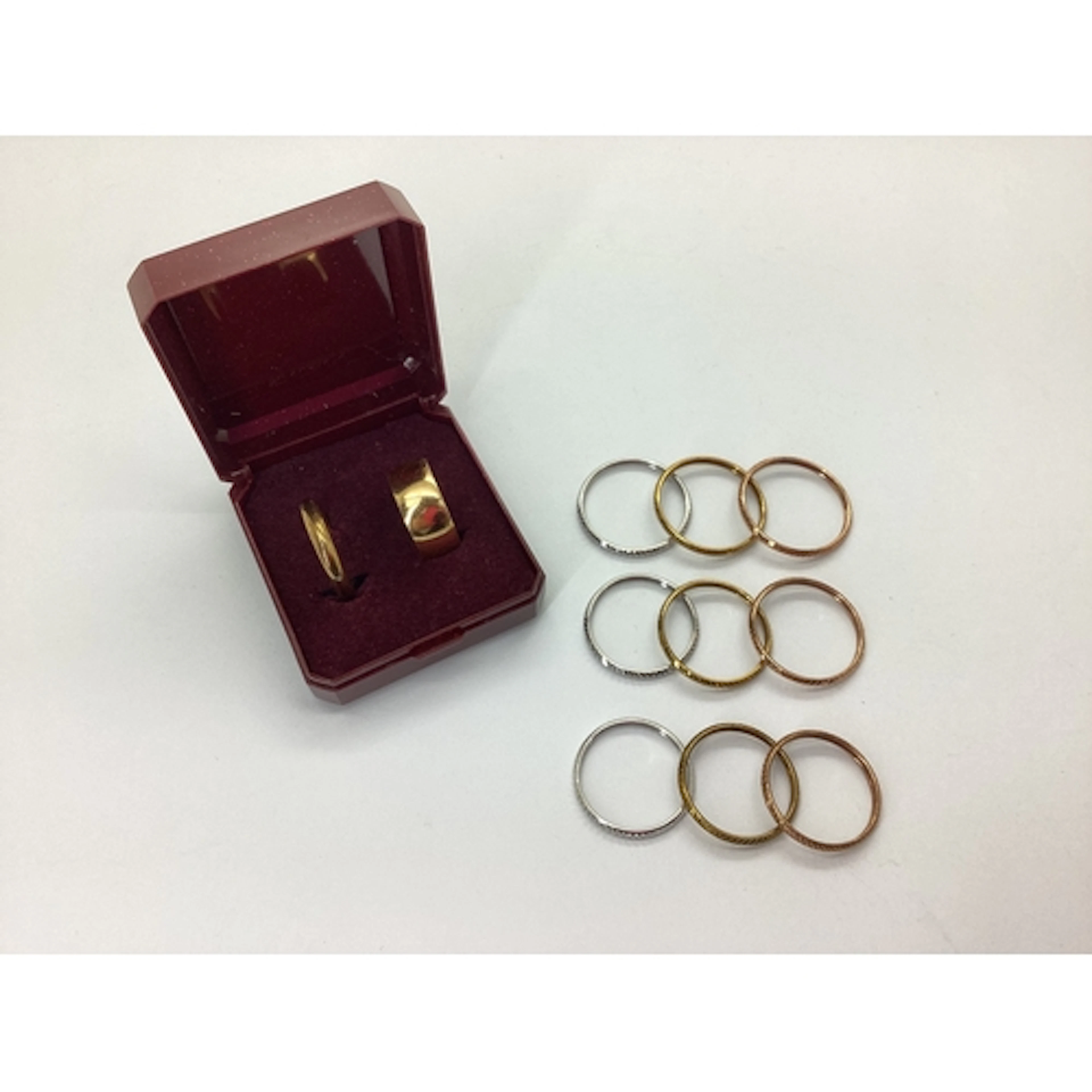 A Plain Wide Wedding Band, stamped "ROLLED GOLD" (finger siz...