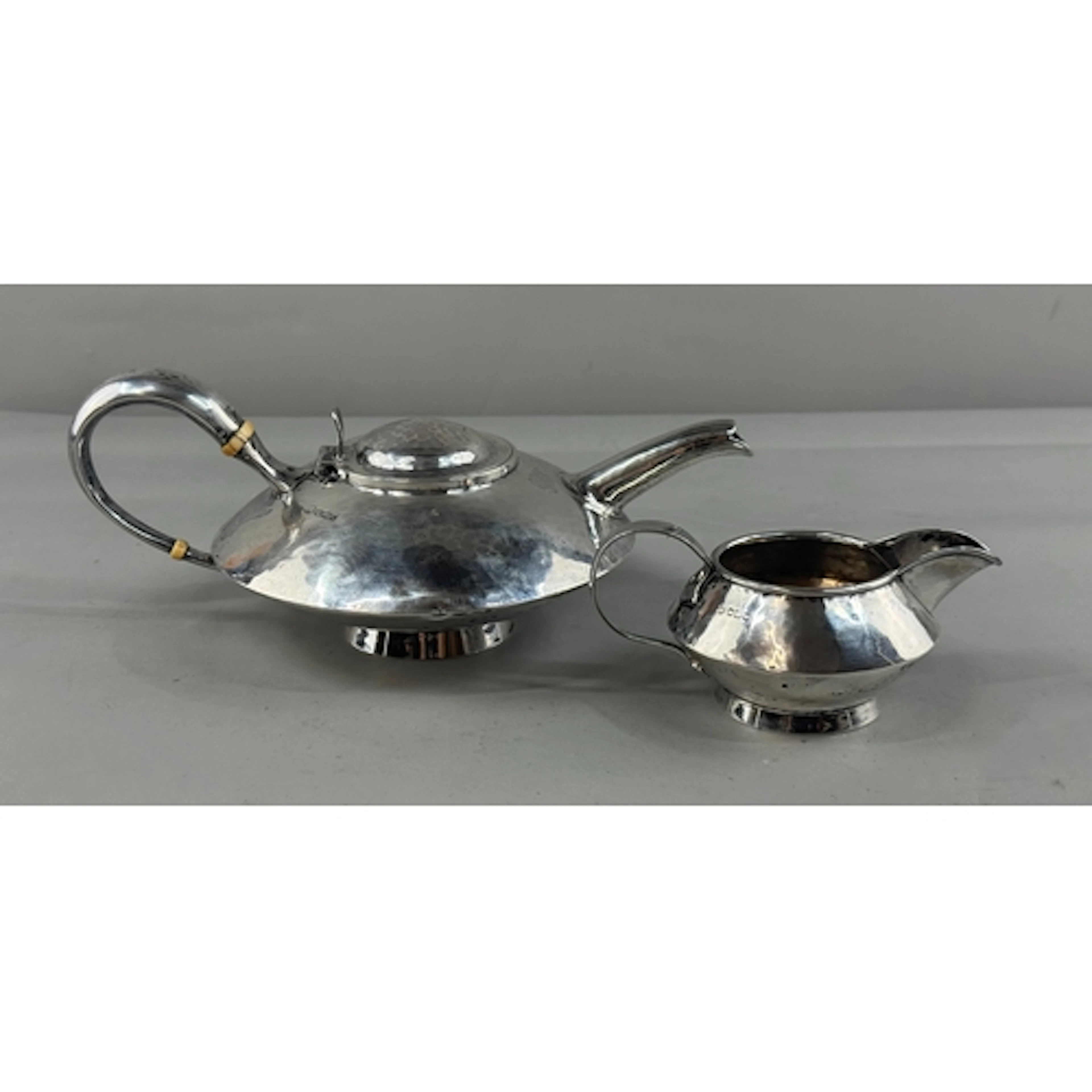 Silver: an Arts and Crafts style planished teapot by John Ro...