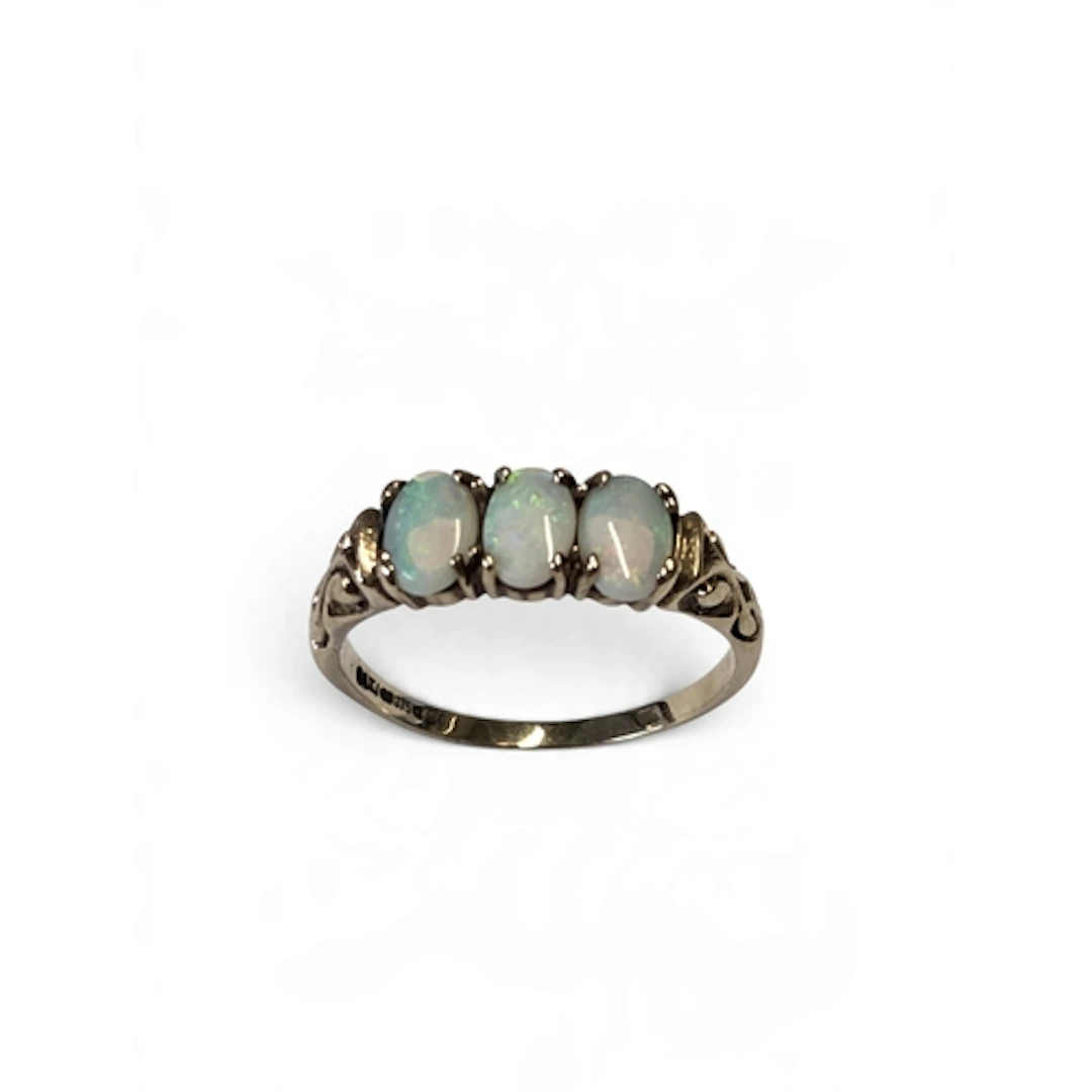 A good 9-carat gold three-stone opal trilogy ring, set with ...