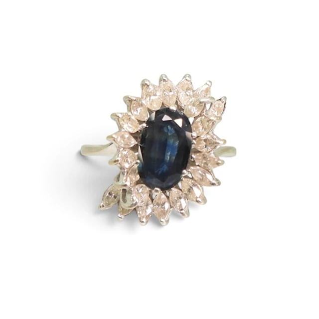 A STATEMENT SAPPHIRE & DIAMOND RING, made in white metal...