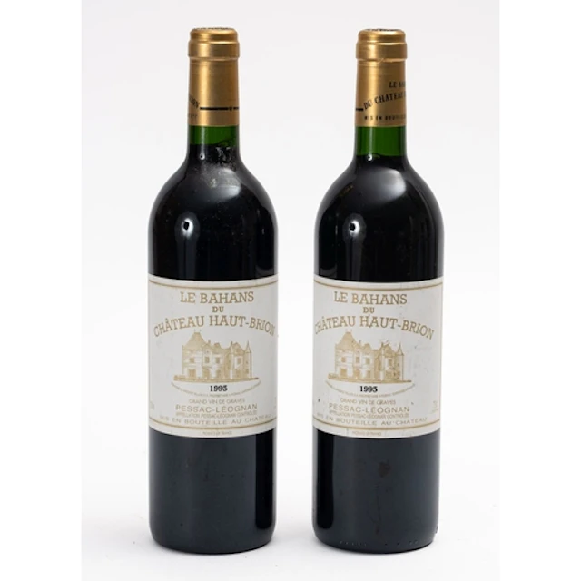 Two bottles of Le Bahans Chateau Haut-Brion 1995. Fill level...