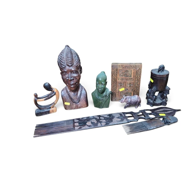 A group of African-style decorative objects comprising portr...