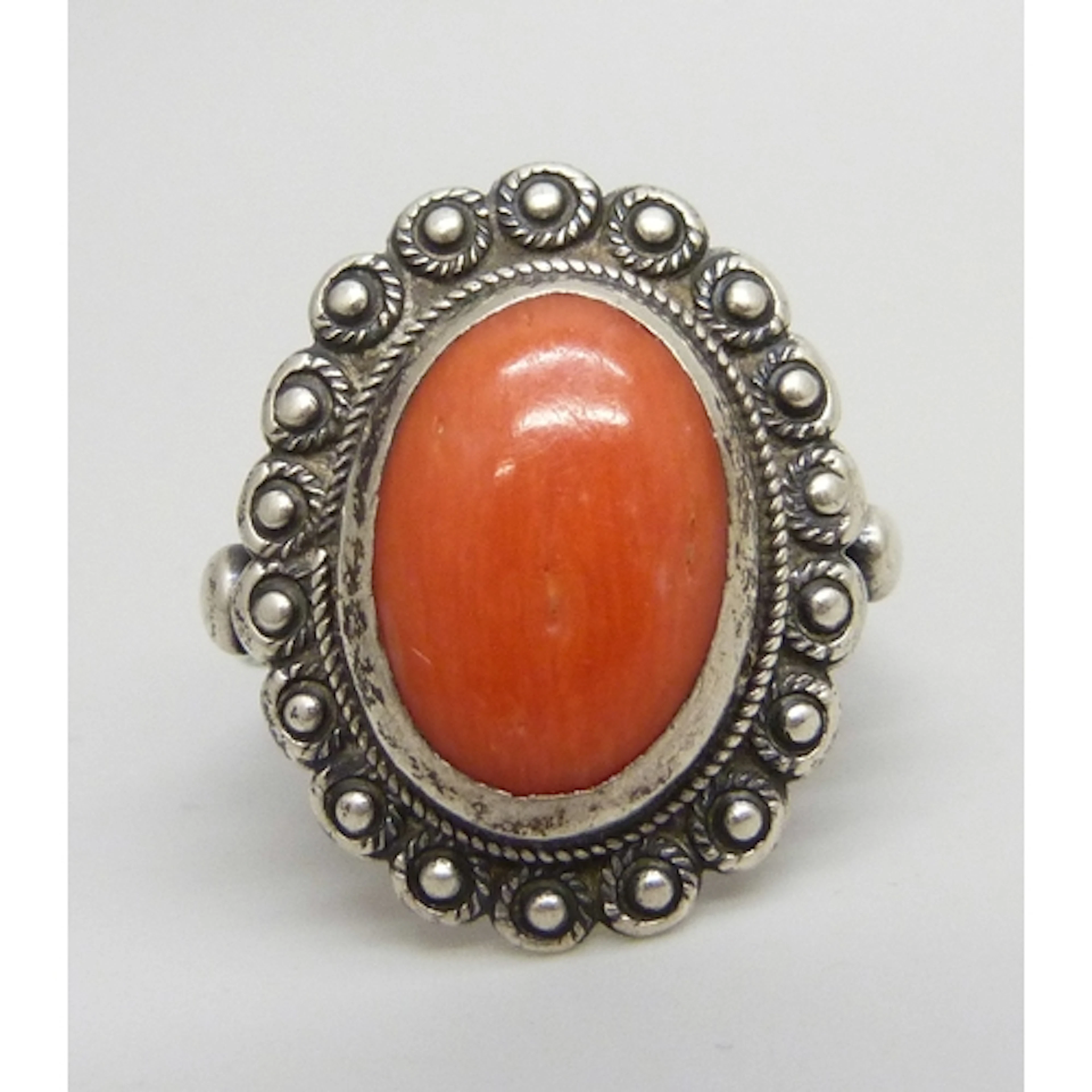 A vintage .800 silver and coral ring, K