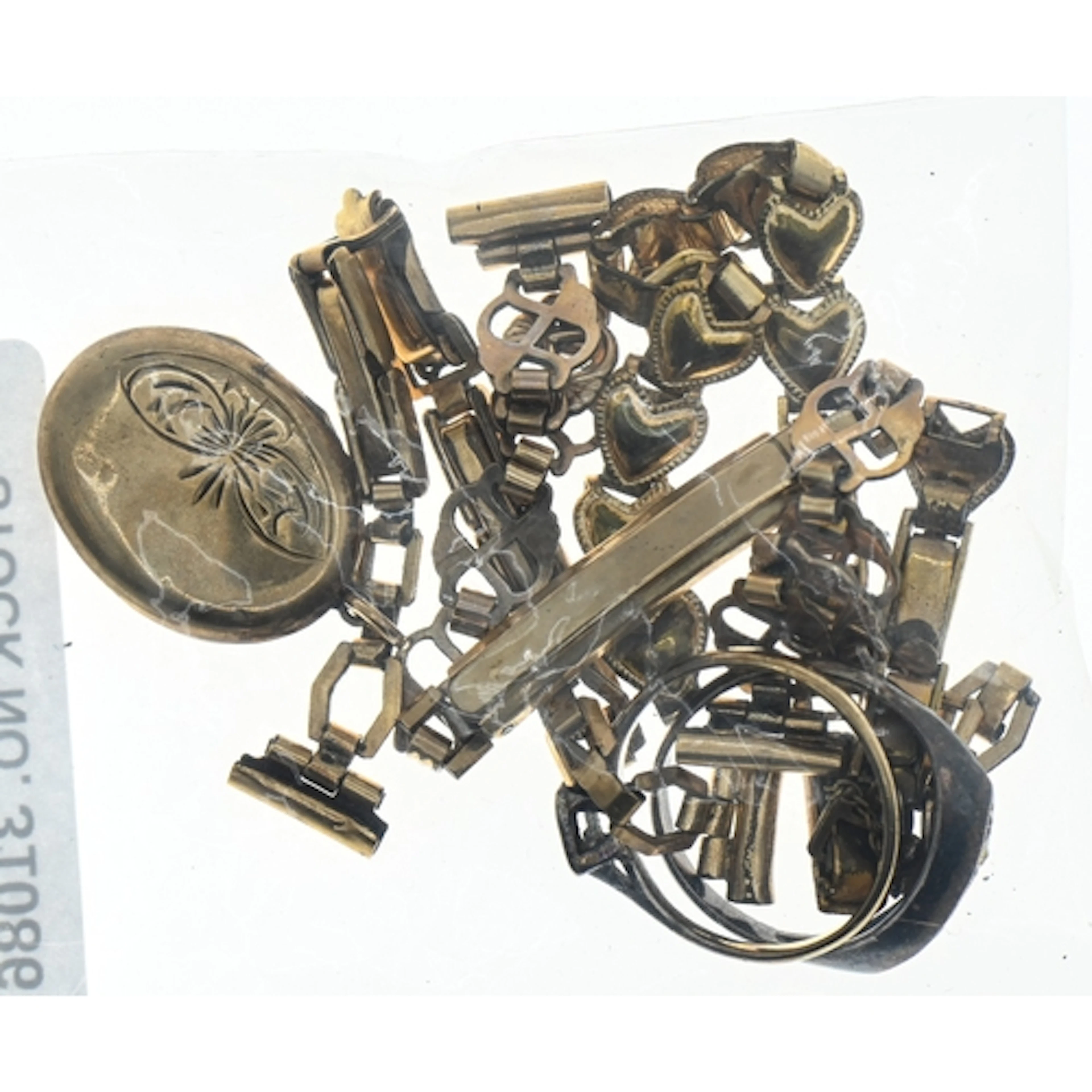 Assorted jewellery, comprising: a '9CT BK-FT' locket; two sc...