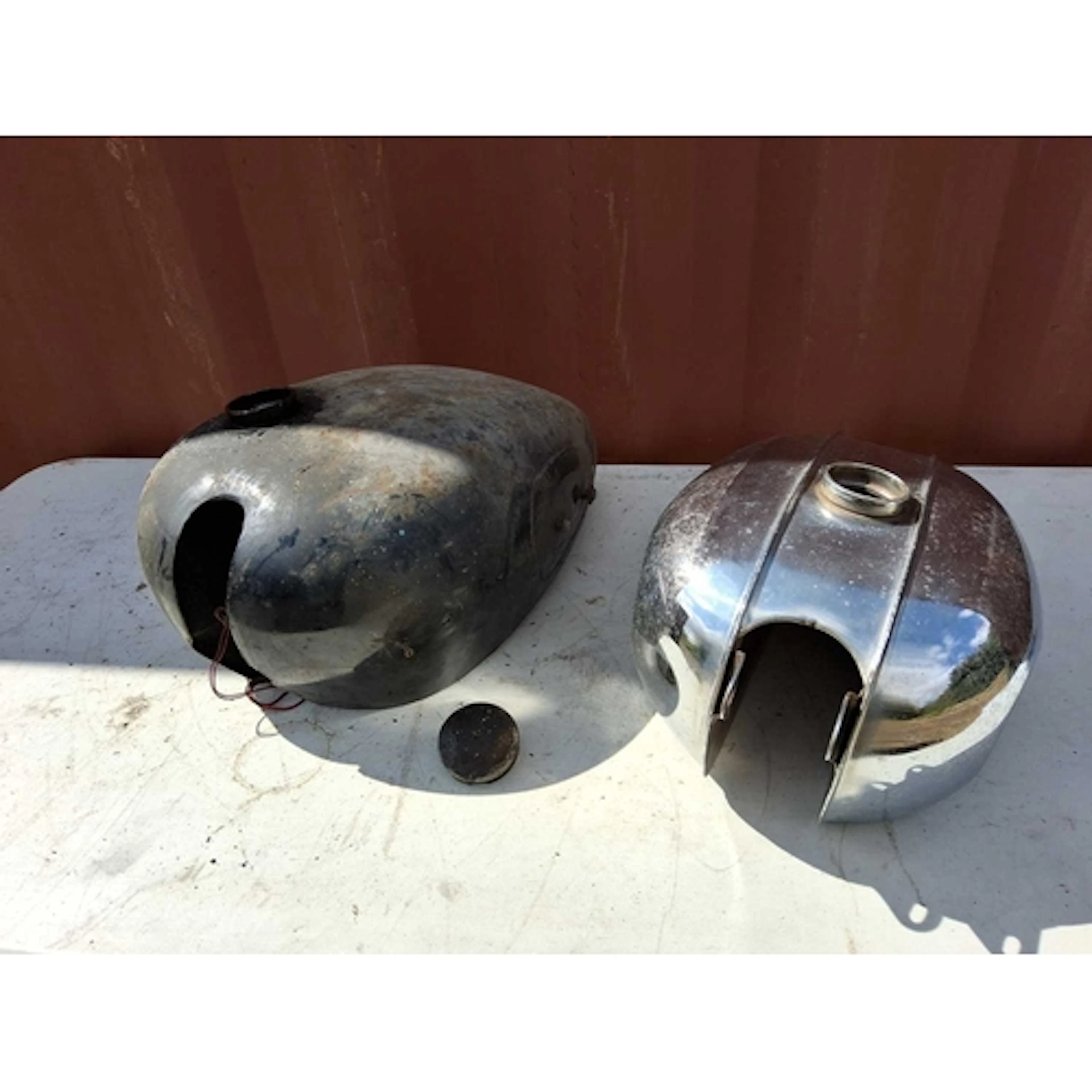 TWO VINTAGE BRITISH MOTORCYCLE PETROL TANKS comprising a bla...