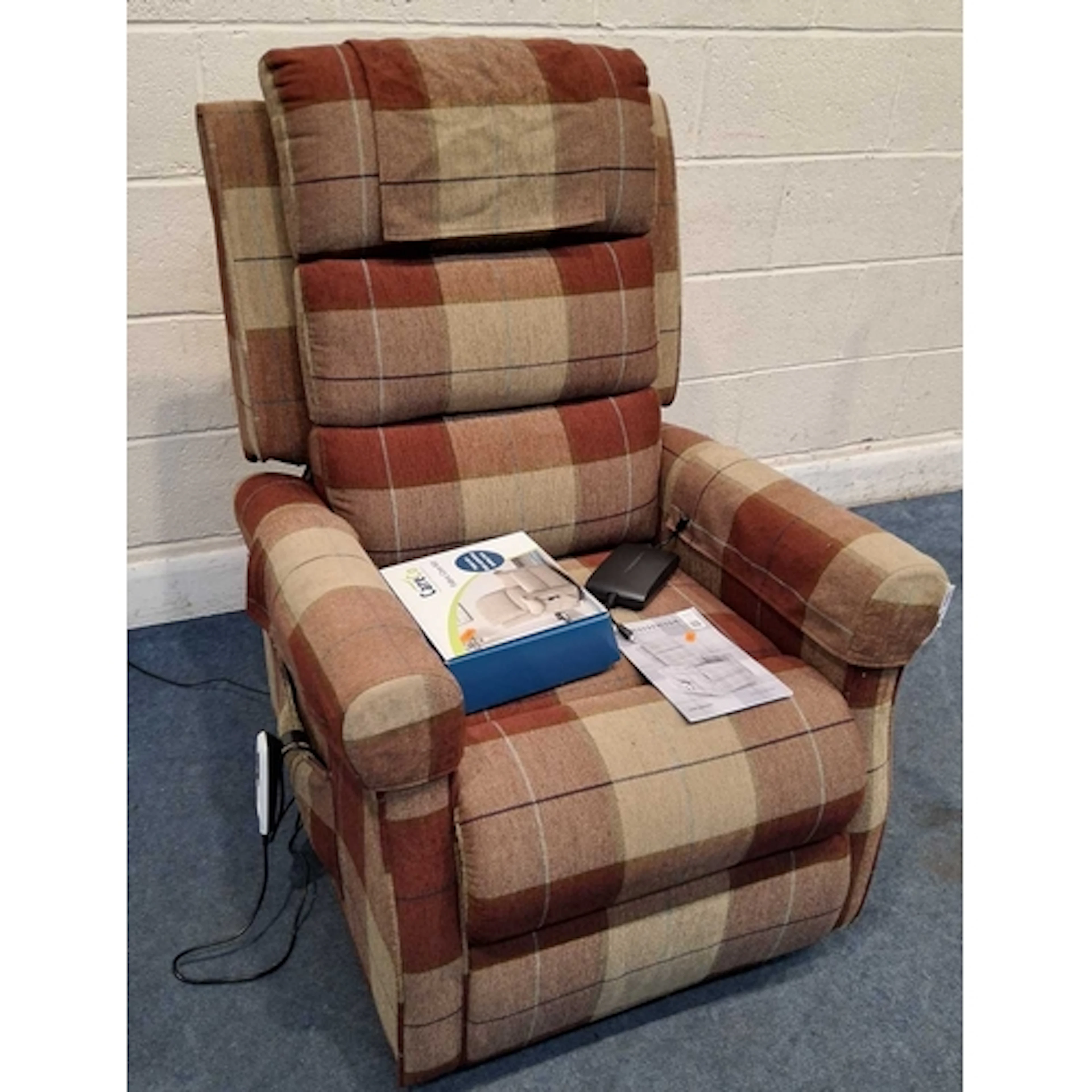 A CARECO BLENHEIM DUAL MOTOR RISE AND RECLINE ARMCHAIR, with...