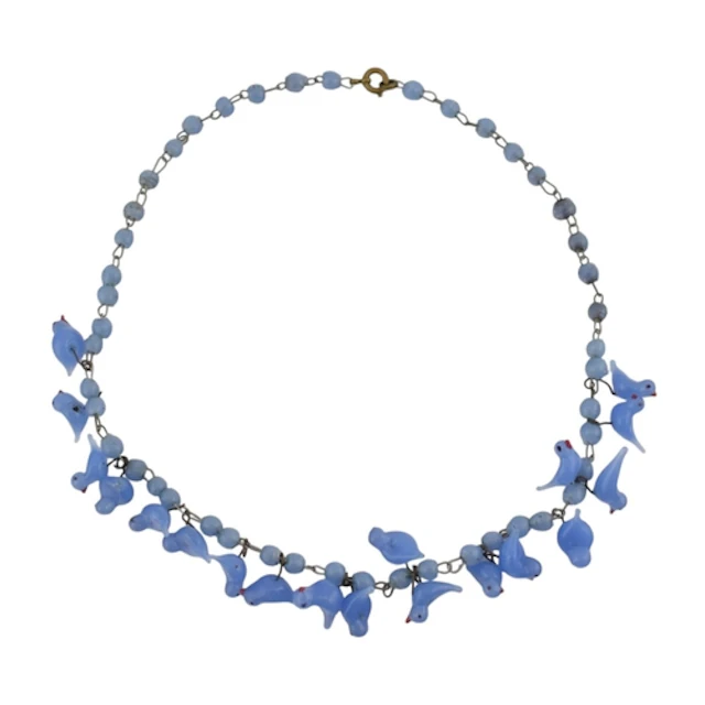 A vintage blue glass lampwork bird bead necklace. The neckla...