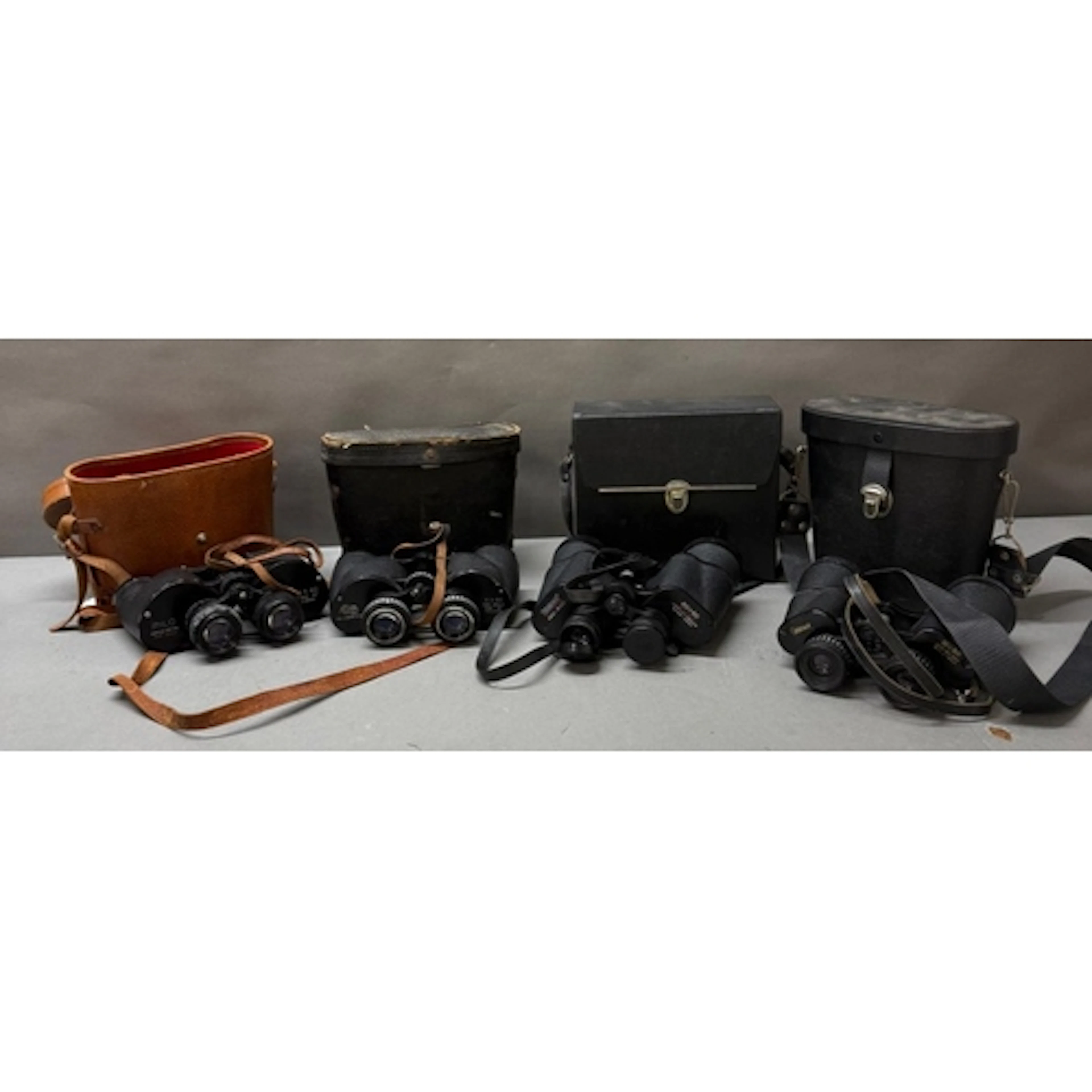 A selection of vintage binoculars, various makers including ...