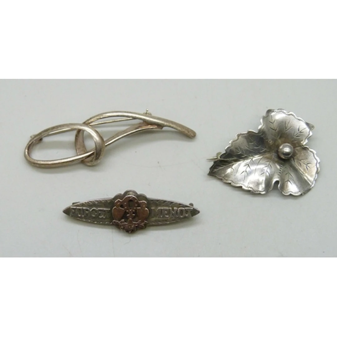 Two silver brooches including a 'Forget Me Not' example with...