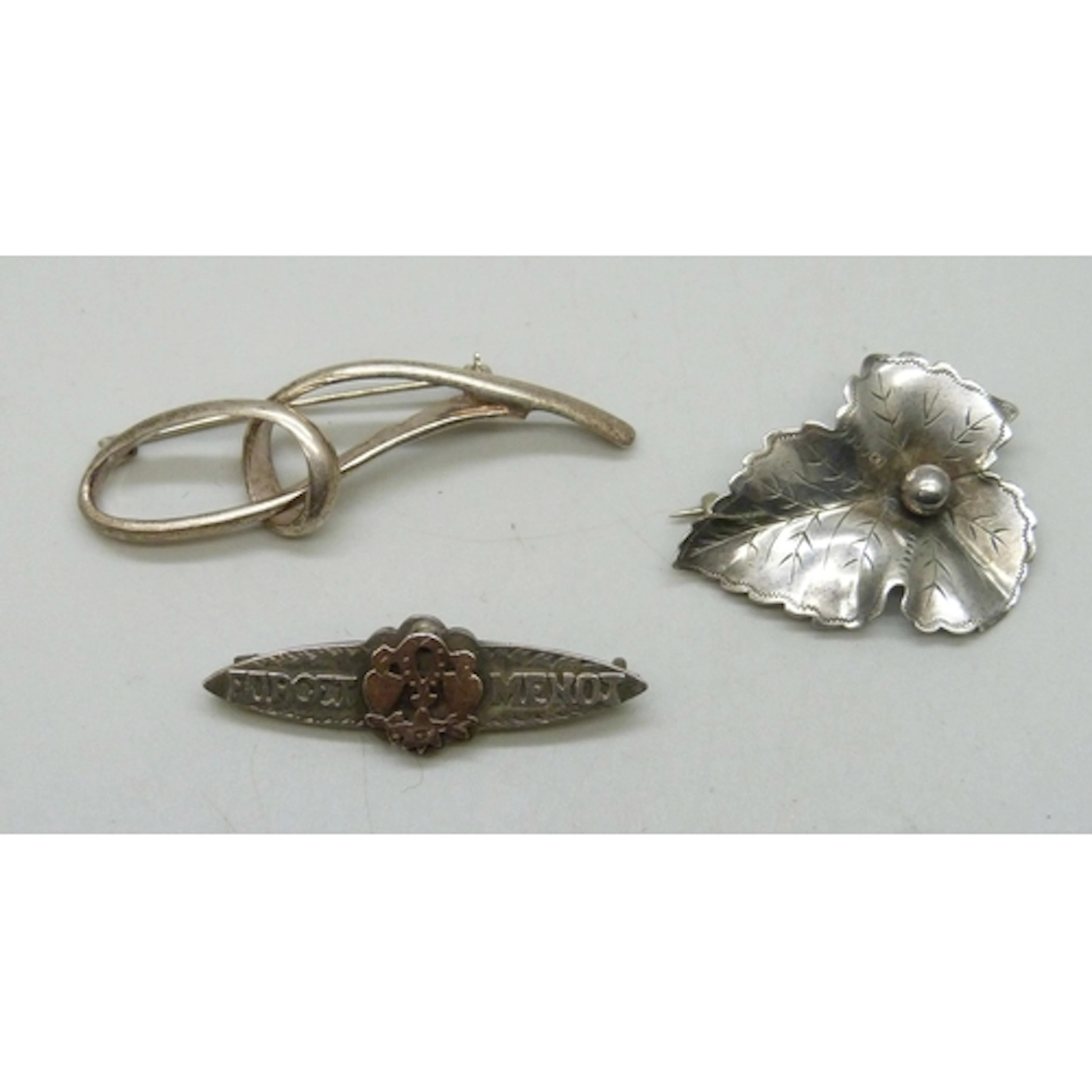 Two silver brooches including a 'Forget Me Not' example with...