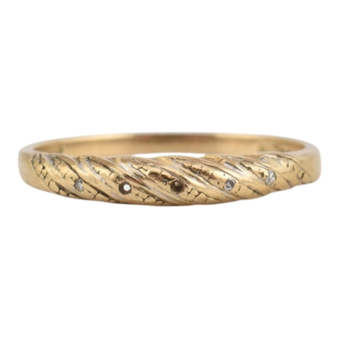 A 1980s hallmarked 9ct gold twisted band ring with diamond c...