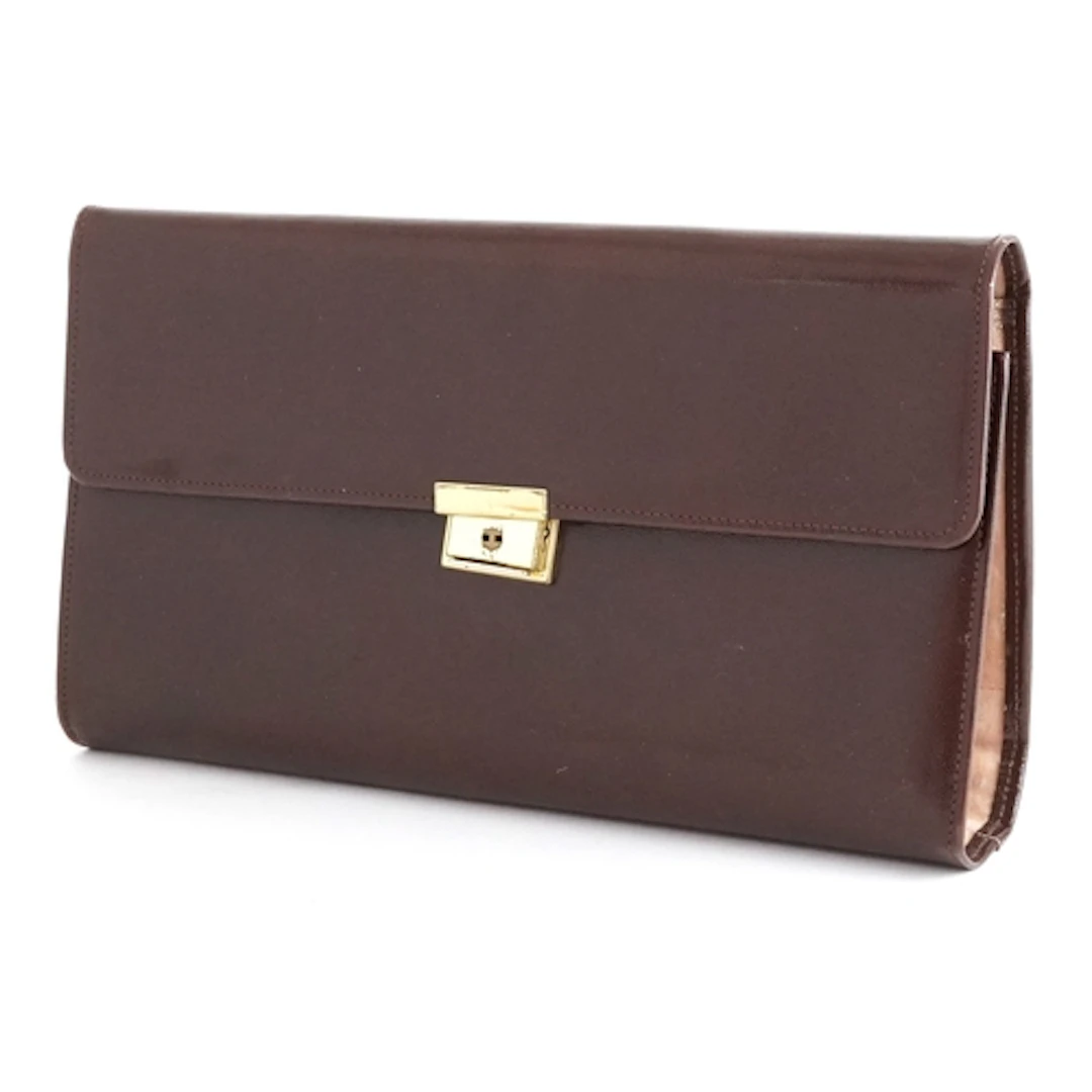 Brown leather jewellery case, 23cm wide.