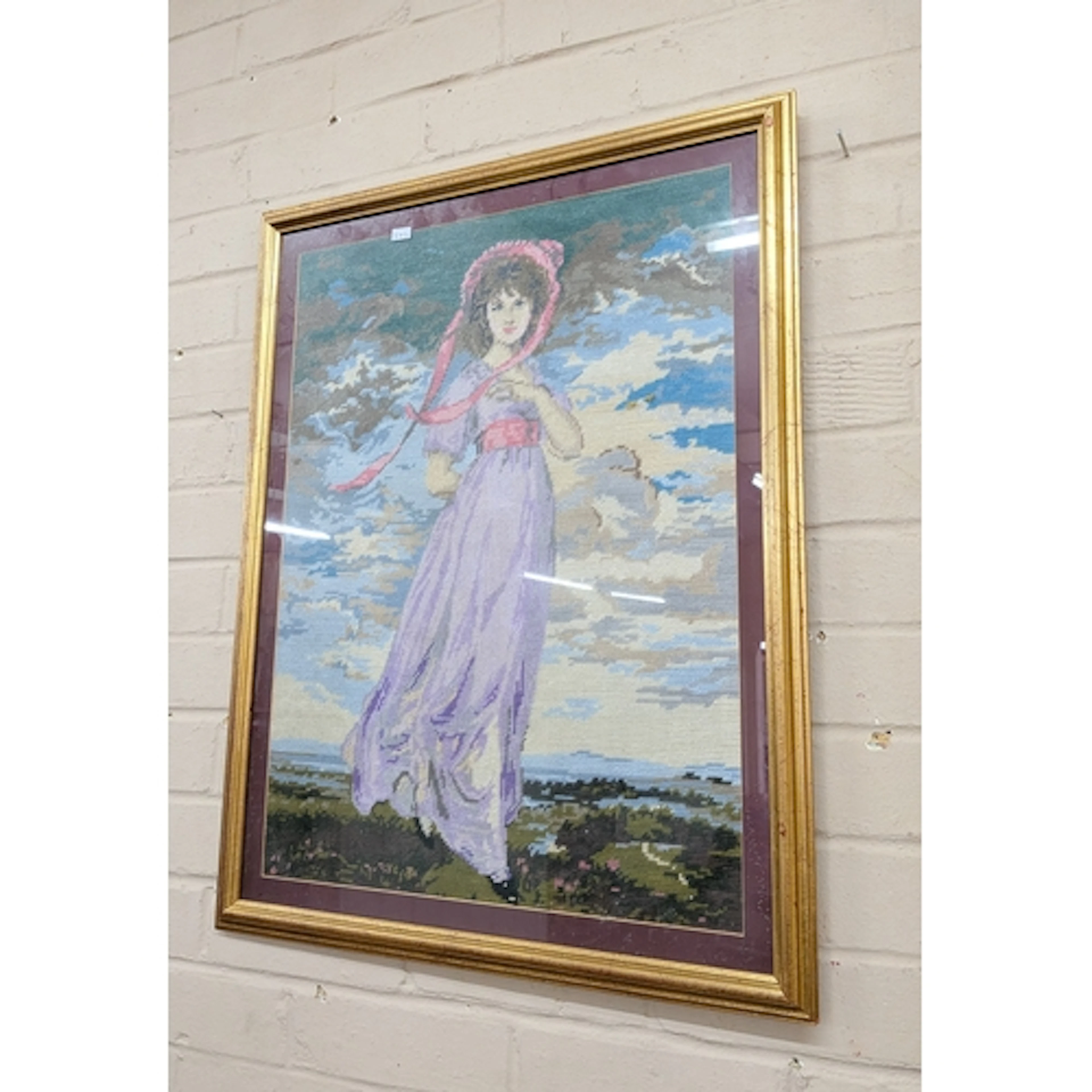 A large needlework tapestry panel of Bo Peep together with a...