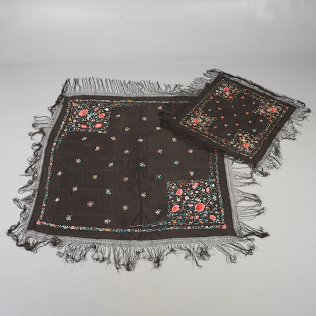 TWO CHINESE EMBROIDERED SILK SHAWLS. Including a smaller bla...