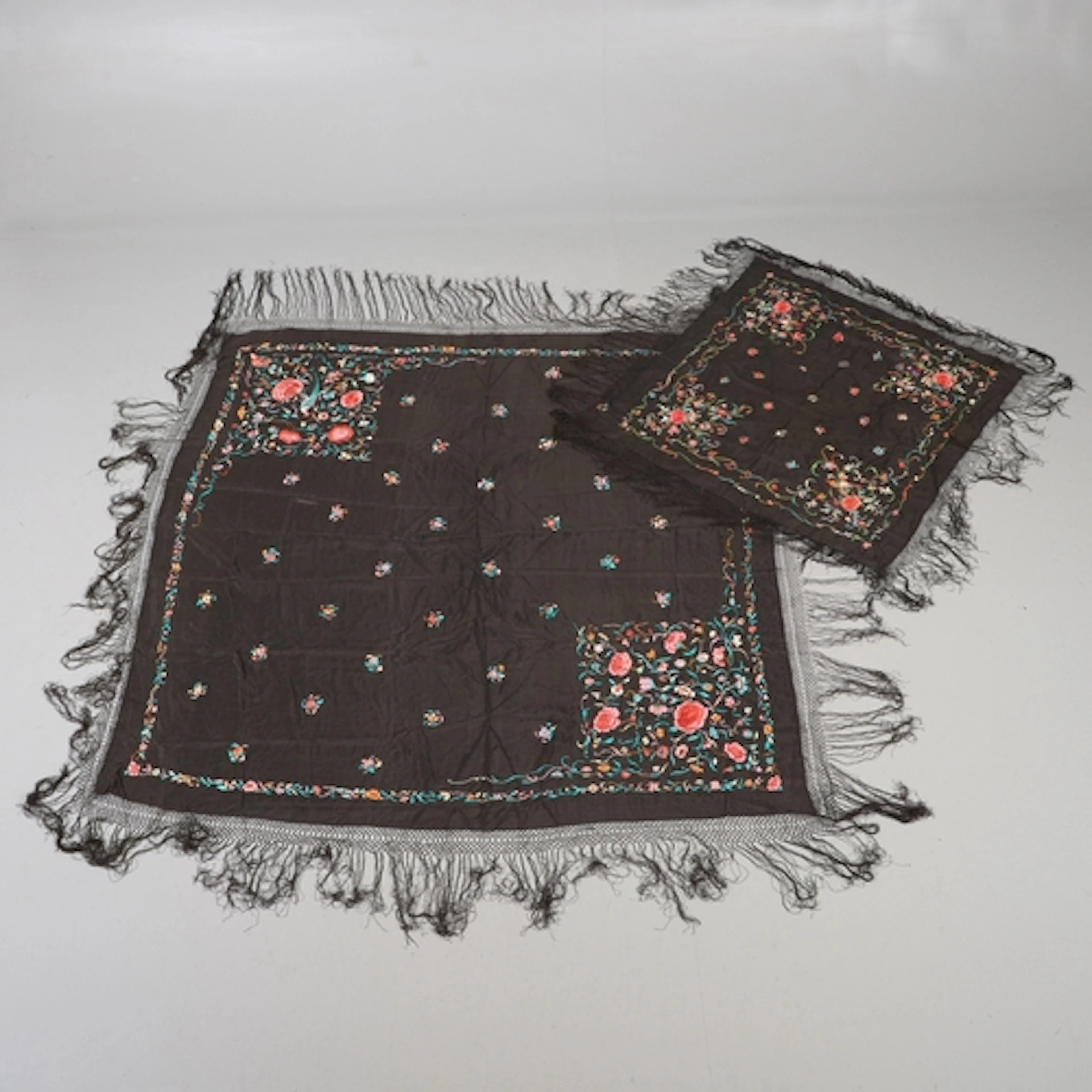 TWO CHINESE EMBROIDERED SILK SHAWLS. Including a smaller bla...