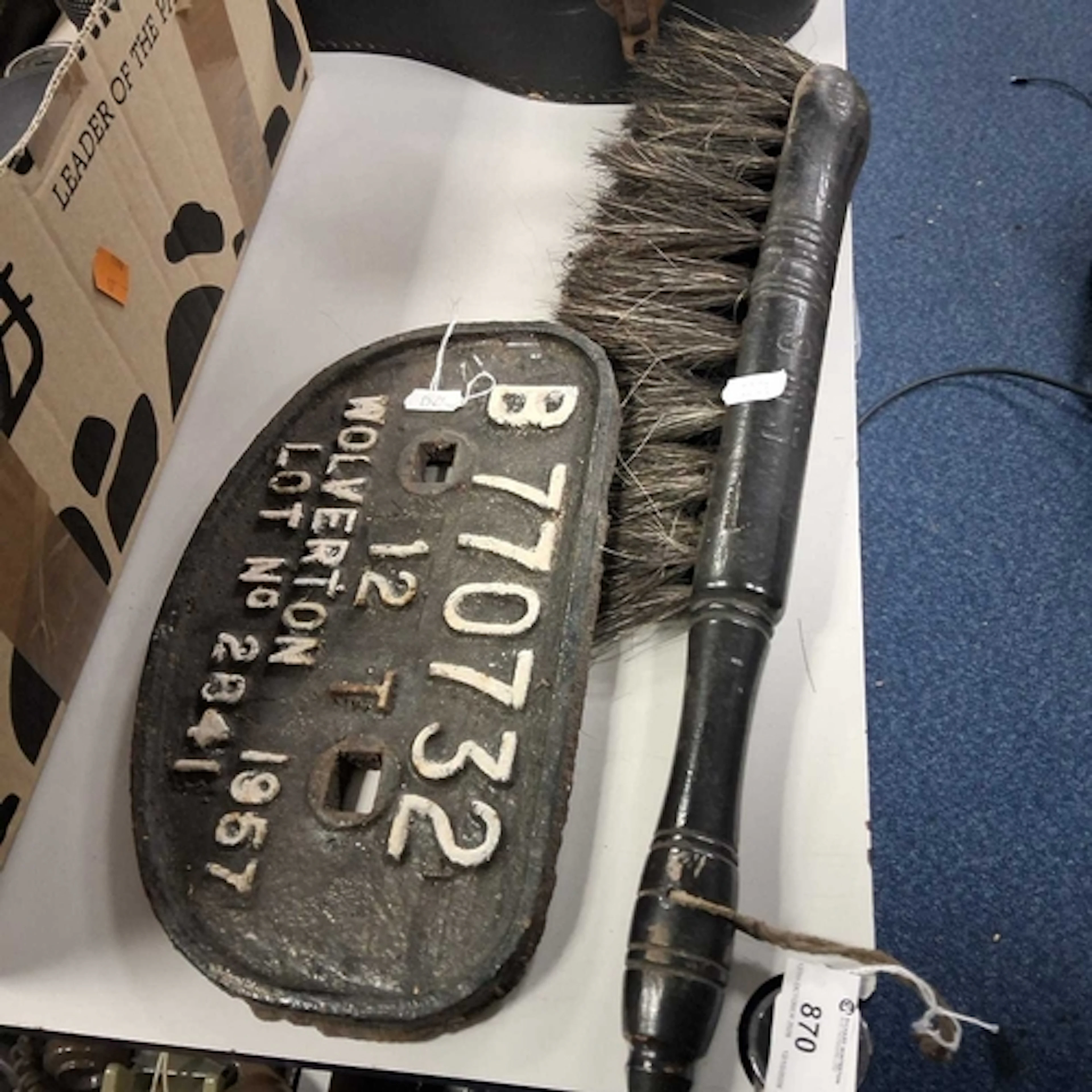 A CAST IRON RAILWAY SIGN AND AN LMS BRUSH comprising a cast ...